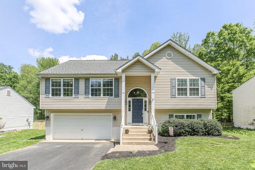 Welcome to your dream home! This charming split foyer residence, built in 2001, offers a perfect blend of comfort and style. With 5 spacious bedrooms and 3 full bathrooms, this home is designed for modern living. The interior boasts elegant crown moldings and ceiling fans, enhancing the warm ambiance throughout. The well-appointed kitchen features essential appliances, including a built-in microwave, gas oven/range, dishwasher, and refrigerator, making meal preparation a delight. The fully finished lower level provides additional flex living space, use the rooms as bedrooms or convert them into a cozy family room or a home office. Situated on a generous 0.28-acre lot, this property backs to serene trees, offering a peaceful retreat in a cul-de-sac setting. The beautifully maintained yard invites outdoor enjoyment, whether you're hosting a barbecue, sitting around the firepit or simply relaxing in nature. Parking is a breeze with an attached garage and ample driveway space. This home combines functionality with a welcoming atmosphere, making it the perfect place to create lasting memories. Don’t miss the opportunity to make this delightful property your own! Schedule a showing today and experience the warmth and charm for yourself.