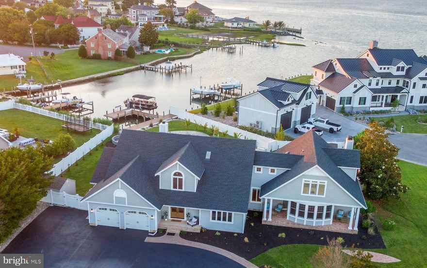 Welcome HQME to 13023 N Shore Rd. – a haven of refined luxury and tranquil waterfront living in Captain’s Hill, one of Ocean City’s most coveted neighborhoods!  Located directly on the Bay, with easy access to Assateague Island, downtown Ocean City and many local marinas, this location is ideal for a large family retreat or an everyday residence in a quiet community.  This stunning property has been recently renovated to perfection and boasts an array of sophisticated features, built with functionality and ease of entertaining in mind.  Step inside to discover a meticulously designed interior, featuring an open floor plan with durable LVP flooring throughout that seamlessly blends spaciousness with comfort and utility. The gourmet kitchen is built to impress with an 8-burner stove, dual dishwashers, dual sinks, an insta-hot, tons of storage, access to the large screen porch and an over-sized island with plenty of seating!  High ceilings, expansive windows, and designer lighting throughout the main level provide an abundance of natural light and the ability to soak in the views of Assawoman Bay and the beautifully appointed backyard.  The main level also contains, a generously sized second master with large en-suite bath and access to the rear deck, a second main level bedroom with en-suite bath that is also accessible via the deck, a dining area, 2 powder rooms, 2 sitting areas, a second laundry room and a huge rec room with wet bar and pool table!  Pass through the 500 sq ft screen porch and you won’t be able to resist the newly re-surfaced salt water pool with propane heater!   The private dock contains an 8,000 lb boat lift, as well as plenty of other docking space for small watercraft.  There is also a built-in playground area for the little ones and a shed for storing your water toys.  Upstairs, you will find 3 more large bedrooms, 2 of which have private balconies and newly updated en-suite bathrooms!  There is a third upstairs bedroom, full hall bathroom, second floor laundry room, and 2 bonus rooms that could be used as additional space for guests.  This exceptional property represents a rare opportunity to own a luxurious retreat in a prime waterfront location - Ocean City, MD is 3 hours from each Philadelphia & DC; 4 hours from NYC and hosts some of the best fishing tournaments on the East Coast!   Whether you seek a peaceful oasis, a place to entertain in style, or a new home base in a beautiful setting, 13023 N Shore Rd offers the ultimate in coastal living.  Schedule your private tour today and experience the epitome of luxury waterfront living firsthand!  Furniture negotiable.