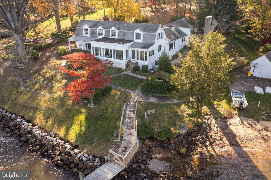 BACK ON THE MARKET AT A NEW PRICE!!! Welcome to your private waterfront oasis located minutes to downtown Annapolis. This stunning 3-bedroom, 2 full bath, 2 half bath home offers unparalleled tranquility and luxury on over 3 acres of lush, wooded surroundings. The original farmhouse was built in 1897 and underwent an extensive renovation in 2009. The home was opened up and walls were removed to maximize the views and bring the property up to modern standards. The main level features a large kitchen with island and space for dining table. Additional features include granite countertops, stainless appliances and jaw dropping views. The kitchen opens to the family room where the highlight is the wall of windows to take in sweeping views of the Severn. Step inside to be greeted by the breathtaking interior featuring gorgeous water views from every angle. Living room off back of kitchen leads to laundry and mud room. Main level master features charming gas fireplace. Upstairs you will find two additional bedrooms with incredible views up and down the river. As you make your way outside, you'll be captivated by the expansive brick patio, ideal for al fresco dining and entertaining while taking in the serene river views. The private pier offers the perfect spot for launching your watercraft, and the sandy beach provides a tranquil retreat for relaxation and enjoying the waterfront lifestyle. Located in a prime waterfront location on the Severn River, this home is a true gem for those seeking privacy and natural beauty. Whether you're unwinding on the patio, strolling through the wooded grounds, or enjoying water activities from your private pier, this property offers the ultimate in waterfront living. Additional features include unfinished basement and large two car attached garage. Convenient waterside shed perfect for all your water toys. All this plus minutes to downtown Annapolis. Don't miss the opportunity to make this remarkable home your own and experience the unparalleled beauty and tranquility of waterfront living in Annapolis, MD. Move right in or renovate to build the home of your dreams. Passing perc test in hand from 2009, just need to renew with county. PLEASE NOTE, THIS IS AN ESTATE SALE AND SOLD AS IS. SALE IS SUBJECT TO EXISTING LEASE IN PLACE UNTIL 5/1/2025. PROOF OF FUNDS REQUIRED FOR ALL SHOWINGS. SHOWINGS PREFERRED 9AM-12PM MON-FRI.