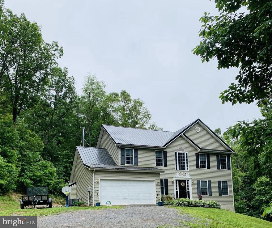 Back on the market at no fault of the sellers!! Ready to move in with completed and CLEARED well test, wood destroying insect test and septic tests (with pumping completed). This beautifully maintained 4 bedroom, 2.5 bath colonial on 5 private acres is the perfect retreat! There are multiple hiking paths on the property that take you to the ridge of the mountain for some breathtaking views. Home features a spacious floor plan, hardwood flooring, granite countertops, double oven in the kitchen (perfect for helping with those holiday meals!), a 1yr old refrigerator and BRAND NEW counter cooktop, full unfinished walkout basement, 5yr old metal roof, landscaping and hardscaping for all seasons, and so much more!  Enjoy a morning cup of coffee in the naturally lit sunroom, a BBQ in the summer on the back patio while your kids play in the yard,  or play a game of pool with your friends. This home provides everything, just bring your things! 305 Warner Ln is perfect for those looking to be closer to nature, to enjoy all the beauty of the mountains while being minutes from Hedgesville town center, Martinsburg and I-81 for commuting. Don't miss your chance to own this beautiful home on 5acres, schedule a showing today!