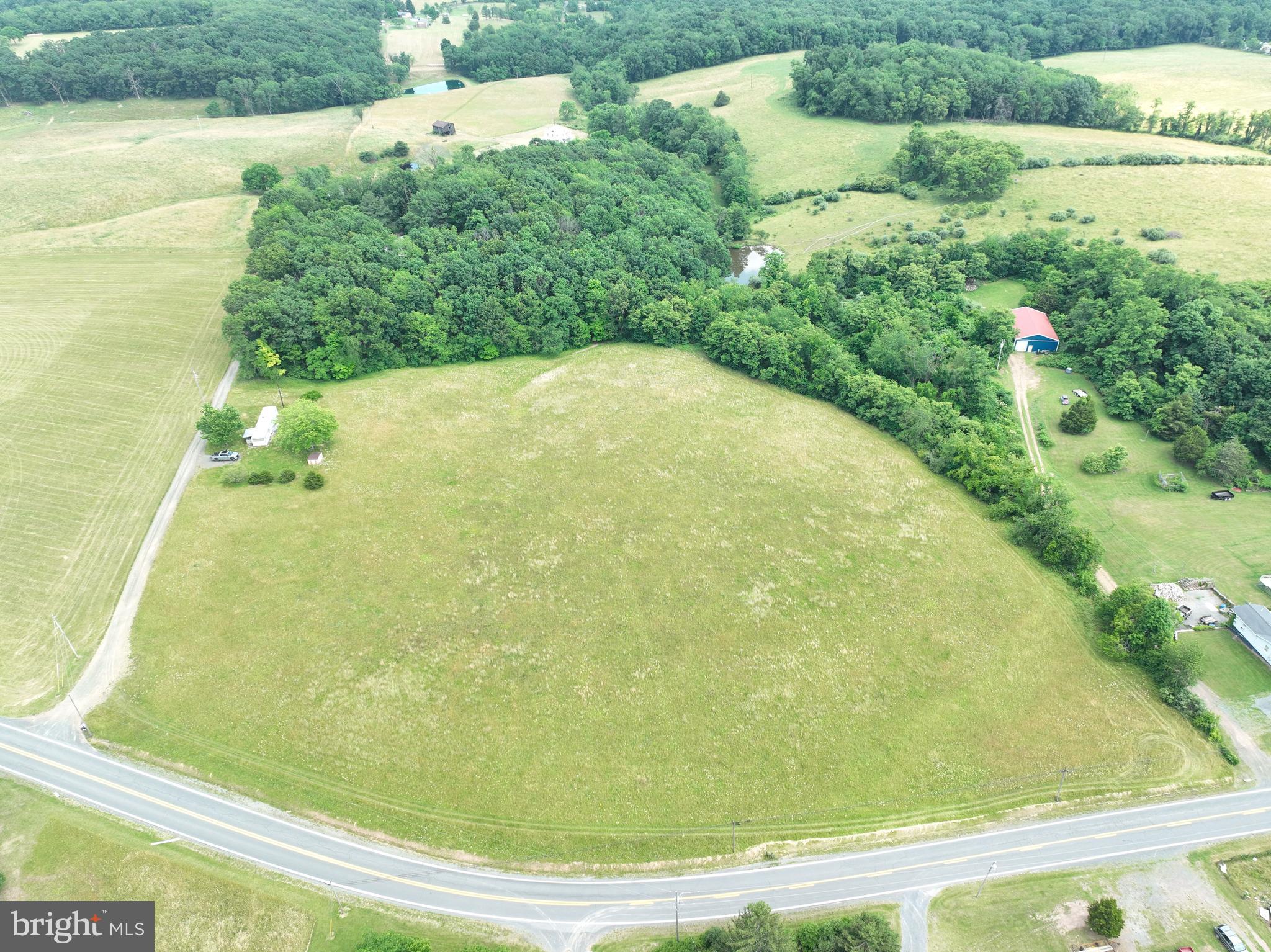 When wide-open space is all that matters, this stunning 9.25-acre property is your perfect haven. Featuring ultra-rare open meadowland, it’s ideal for enjoying life in the heart of Hampshire County, WV. With easy access directly from a public highway and electricity within reach, convenience is a given. The property boasts a beautiful mix of rolling pasture and towering hardwood timber. Additionally, it offers the perfect homesite, ready for your dream home. With no HOA, you have the freedom to create your country lifestyle as our forefathers intended. Conveniently located off US Route 50, you can travel from your rural paradise to Dulles Airport in just 2 hours. This exceptional parcel has something for everyone. Whether you're looking to return to the country or seeking an escape, this dramatic property will not disappoint.