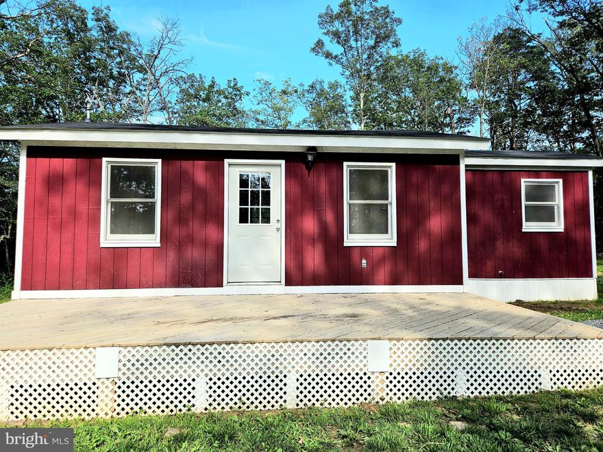 Surrounded by towering trees and the gentle whisper of the wind this cabin promises a peaceful and private getaway far from the city's hustle and bustle, 2 acres, hunting allowed, you will fall in love with this completely renovated cabin, red oak floors, maple cabinets, quartz counters in the kitchen, bathroom and in the bedrooms, custom built-in closets with quartz  dresser tops,  all new kitchen, new bath, laundry room area in the mudroom with  entry door that leads out back onto a 4x12 rear deck, 200 amp service, this little gym is almost brand new, roof, walls, wiring, & plumbing,  make it your year around residence relaxing on the 10x24 front deck OR perfect for Airbnbs, OR just your weekend getaway,  "whatever" this cozy secluded  cabin offers it all........ Its a must look for yourself!
