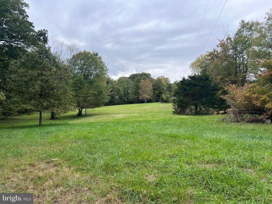 1 + Acre lot ready to BUILD! Everything is ready for you to build your new home on this cleared and flat lot with an easy entrance off the road.. Approved septic for up to 4 occupants.