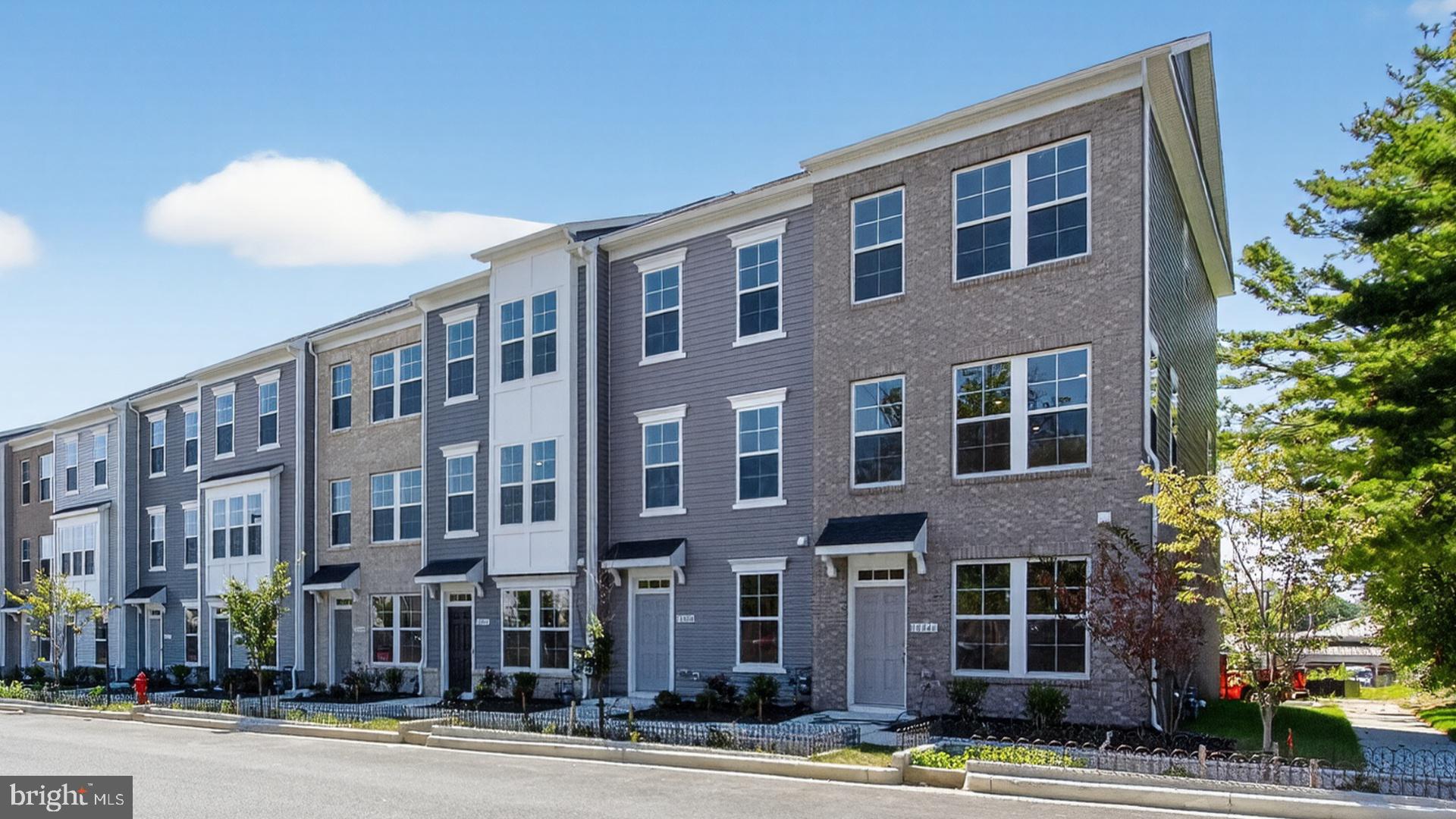 Most affordable new townhomes in the heart of Montgomery Village – Available Now!
Welcome to the Abbey—a thoughtfully designed, open-concept townhome where style meets everyday convenience. From the welcoming foyer to the light-filled living spaces, every detail is crafted for comfort and functionality.
• Entry-level bedroom with full bath – perfect for guests, parents, or a private home office
• Bright and sunny second-floor living area featuring a spacious family room with sliding glass doors to your private deck
• Gourmet-inspired kitchen with a generous center island, ample cabinetry, and a separate dining room for both casual meals and formal gatherings
• Two upper-level bedrooms, each with its own bath and generous closet space for storage and organization
• Separate laundry room and additional hallway closet on the upper level for added convenience
• Rear-load garage plus driveway for extra parking
• Open-concept layout designed to maximize natural light and create an inviting flow through every floor Blending modern finishes, a versatile floor plan, and an unbeatable location, the Abbey offers the perfect place to call home in Montgomery Village.
