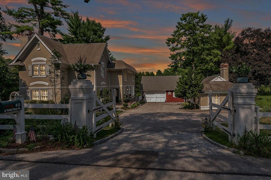 Once part of the historic Chestnutwold Farm, a highly regarded estate in Radnor Township, this 1841 home is a rare blend of heritage and modern livability. Thoughtfully reimagined over time, the property is a collection of inviting spaces, offering a main residence, a charming guest cottage, and a versatile barn—all set around a welcoming courtyard on 1+  beautifully maintained acres.

The main house is rich in character, with a gracious front entry leading to a turned staircase and a fireside living room just beyond, perfectly scaled for gatherings. A sunroom, wrapped in windows, offers year-round views of the gardens, bluestone terrace, and stunning pool. The open dining area flows seamlessly into the family room, where built-in bookshelves frame a gas fireplace, creating an intimate yet open space for daily living. Rough-sawn beams, deep window sills, and hardwood floors throughout add warmth and authenticity.

Designed with both function and style in mind, the kitchen features soapstone countertops, classic painted cabinetry, and a suite of Thermador appliances, including a five-burner gas cooktop, double ovens, and a built-in refrigerator. A side entrance provides practical storage for coats and pantry items, while a cleverly tucked-away rear entry, hidden behind a barn door, reveals a potting sink and laundry area. A powder room completes the main level.

Upstairs, the primary suite is bathed in natural light, offering multiple closets and a well-appointed bath with a double vanity, soaking tub, glass-enclosed shower, and private water closet. Three additional bedrooms include one with an ensuite bath, while two others share a beautifully tiled hall bath. A flexible fifth room, currently a Peloton space, could easily serve as an office or nursery.

Across the courtyard, the former gardener’s cottage has been transformed into a guest retreat, complete with Dutch doors on both the front and back, a vaulted ceiling with wood detailing, hardwood floors, a full kitchen, and a beautifully remodeled bath. Below, a brick-floored bar and recreation space create a cozy, tucked-away gathering spot. Additional storage and mechanicals are neatly integrated into this level.

One of the original 19th-century barns stands proudly at the entrance to the courtyard, serving as garage space, a party barn, and additional storage. The surrounding grounds are designed for both relaxation and entertaining, with a deep bluestone terrace, fire pit, and a striking pool that blends seamlessly into the landscape.

Meticulously maintained and carefully updated, this property balances the craftsmanship of its 1841 origins with the easy flow and connection of a modern floor plan. It is a home that welcomes, inspires, and lives beautifully in every season.