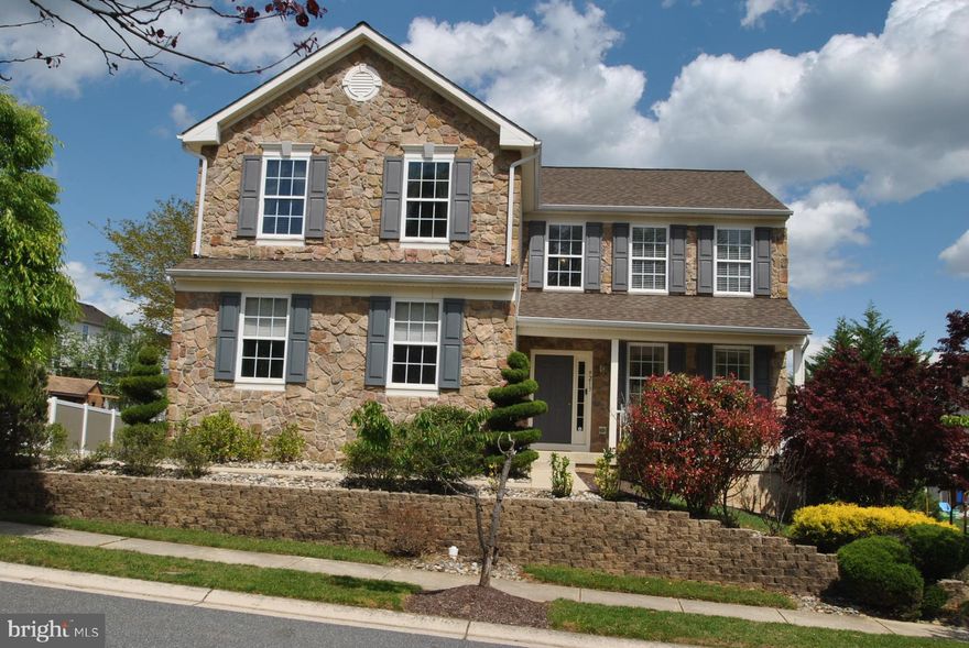 STUNNING STONE FRONT COLONIAL IN MOORES ORCHARD COMMUNITY! FEATURES: 5 BEDROOMS 3.5 BATHS, OPEN TWO STORY FAMILY ROOM WITH FLOOR TO CEILING STONE FIREPLACE, GORGEOUS HARDWOOD FLOORING THRU LIVING, DINING AND FOYER AREAS, EAT IN KITCHEN WITH NEW STAINLESS STEEL APPLIANCES (2020), CORIAN COUNTERS, CERAMIC TILED BACK SPLASH AND CERAMIC TILED FLOOR, BRAND NEW CARPETING JUST INSTALLED ALL THRU UPPER LEVEL OF THE HOME (2021), FRESHLY PAINTED THRU-OUT, OVERSIZED 2 CAR SIDE LOAD GARAGE WITH NEW OPENER (2021), NEW ROOF (2018), NEW HVAC SYSTEM WITH HEPA AIR CLEANER AND UV LIGHT AIR PURIFIER (2019), OWNERS SUITE WITH SEPARATE LUXURY SPA BATH, FULLY FINISHED WALKOUT BASEMENT WITH 5TH BEDROOM AND 3RD FULL BATH PERFECT FOR GUEST BEDROOM OR AU PAIR SUITE, LARGE FLAT REAR YARD, REAR DECK AND TOO MUCH MORE TO LIST HERE!