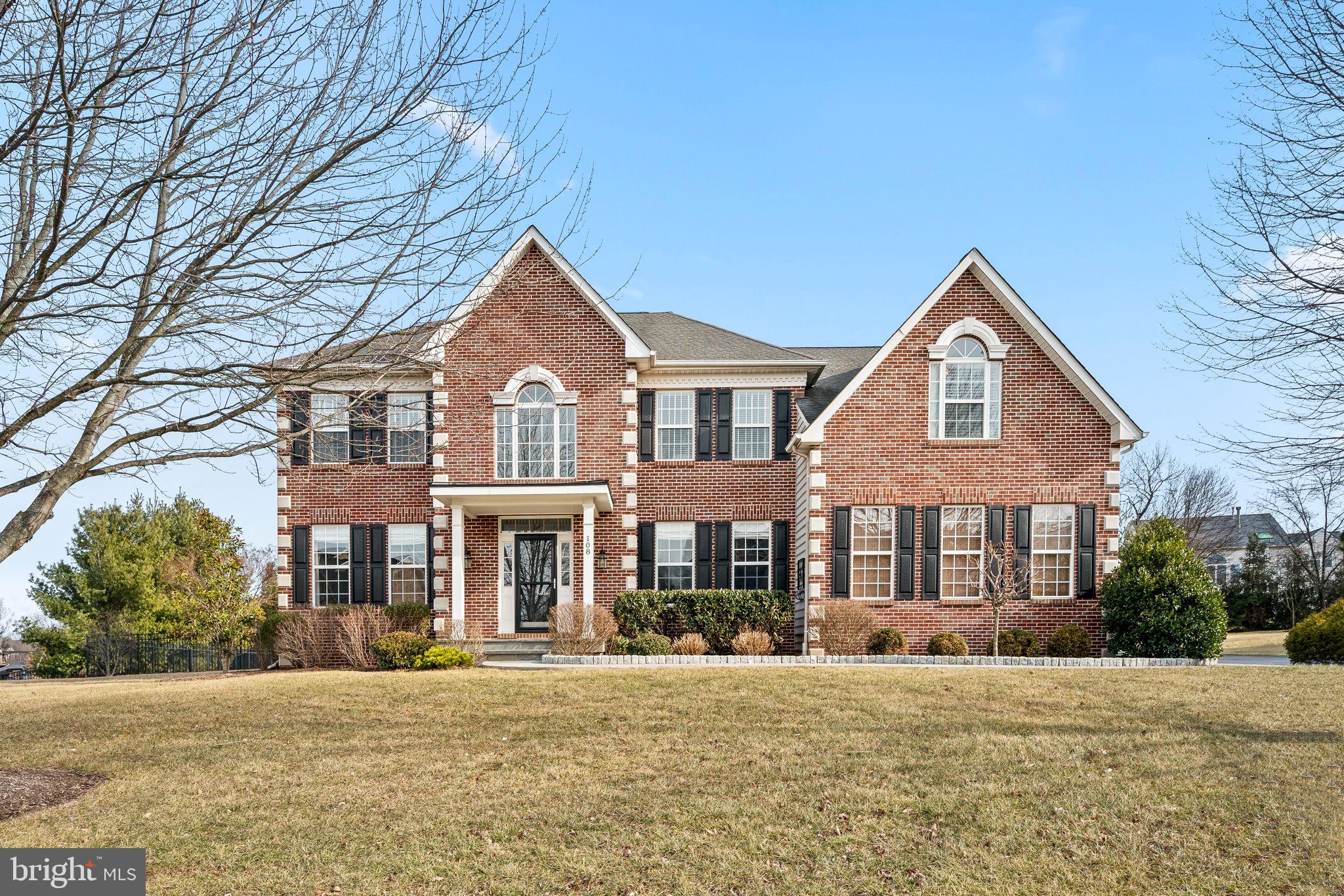 Welcome to 108 Ithan Lane, an exquisite brick-front colonial residence situated in the highly desirable Valley Green Estates, within the esteemed Spring-Ford School District. This is a rare opportunity to own in this very special community. Every detail of this stunning four-bedroom, 2.5-bath home has been thoughtfully curated to create a warm and inviting atmosphere...from the moment you step inside from the custom flagstone walkway and front porch, you’ll feel at home. The entrance boasts a two-story foyer that receives ample natural light and is enhanced by 5” solid hickory wood flooring, providing both elegance and a seamless flow throughout much of the first floor. A striking, handpicked chandelier serves as the focal point, casting a warm, inviting glow. Dual coat closets provide both convenience and functionality, while the gorgeous open stairway adds an elegant touch, setting the tone for the rest of the home. To the left, a perfectly sized living room offers a cozy, yet spacious retreat, ideal for relaxing or entertaining. It transitions naturally into the spacious dining room, which features an elegant bay window, a gorgeous custom chandelier and with a view of the rear yard. To the right of the entrance, a versatile space awaits - perfect for home office, playroom or anything that suits your needs. The heart of the home is the upgraded kitchen, featuring modern appliances, updated cabinetry, subway tile backsplash and an effortless connection to the expansive family room tastefully appointed with a simple, elegant gas fireplace. This fabulous room is a breathtaking space with soaring cathedral ceilings and a dramatic wall of windows, saturating the space with natural light and warmth. Nestled between these two areas, the breakfast nook provides a perfect spot to enjoy morning coffee, with dual upgraded Pella sliding glass doors offering easy access to the fabulous rear yard. Thoughtful details abound, from the tasteful trim work and unique window treatments to the carefully curated lighting that enhances each room's charm.
For added convenience, an additional staircase is tucked away off of the kitchen space and leads directly to the luxurious primary suite. This expansive retreat includes a gorgeous sitting room, a dreamy walk in dressing area with built in closet organizers, and an enormous living space with trayed ceilings and a ceiling fan. The en suite bathroom is equipped for comfort and relaxation, featuring dual vanities, a glass stall shower and a luxurious soaking tub. Two additional closets in the primary room provide ample storage, ensuring you’ll never run out of space. Three generously sized bedrooms, a practically designed full bathroom and an upper-level laundry room with a linen closet complete the second floor. Throughout the upper floor there is brand new plush, neutral carpeting that will hug your feet every step of the way.
The yard of this home is an absolute delight, offering endless opportunities for relaxation and entertainment. A thoughtfully designed two-tiered deck, complete with built -in lighting, seamlessly transitions to a stunning flagstone patio – perfect for hosting gatherings or enjoying quiet moments outdoors. The mature landscaping enhances the charm of the fully enclosed aluminum fenced rear yard, providing both beauty and privacy. Beyond the outdoor oasis, this home offers practicality and convenience with a spacious three car garage, ensuring ample room for parking and extra storage. This home is close to so many major roadways and shopping, yet somehow tucked away from it all. You don’t want to miss the opportunity to make this special home your own.
