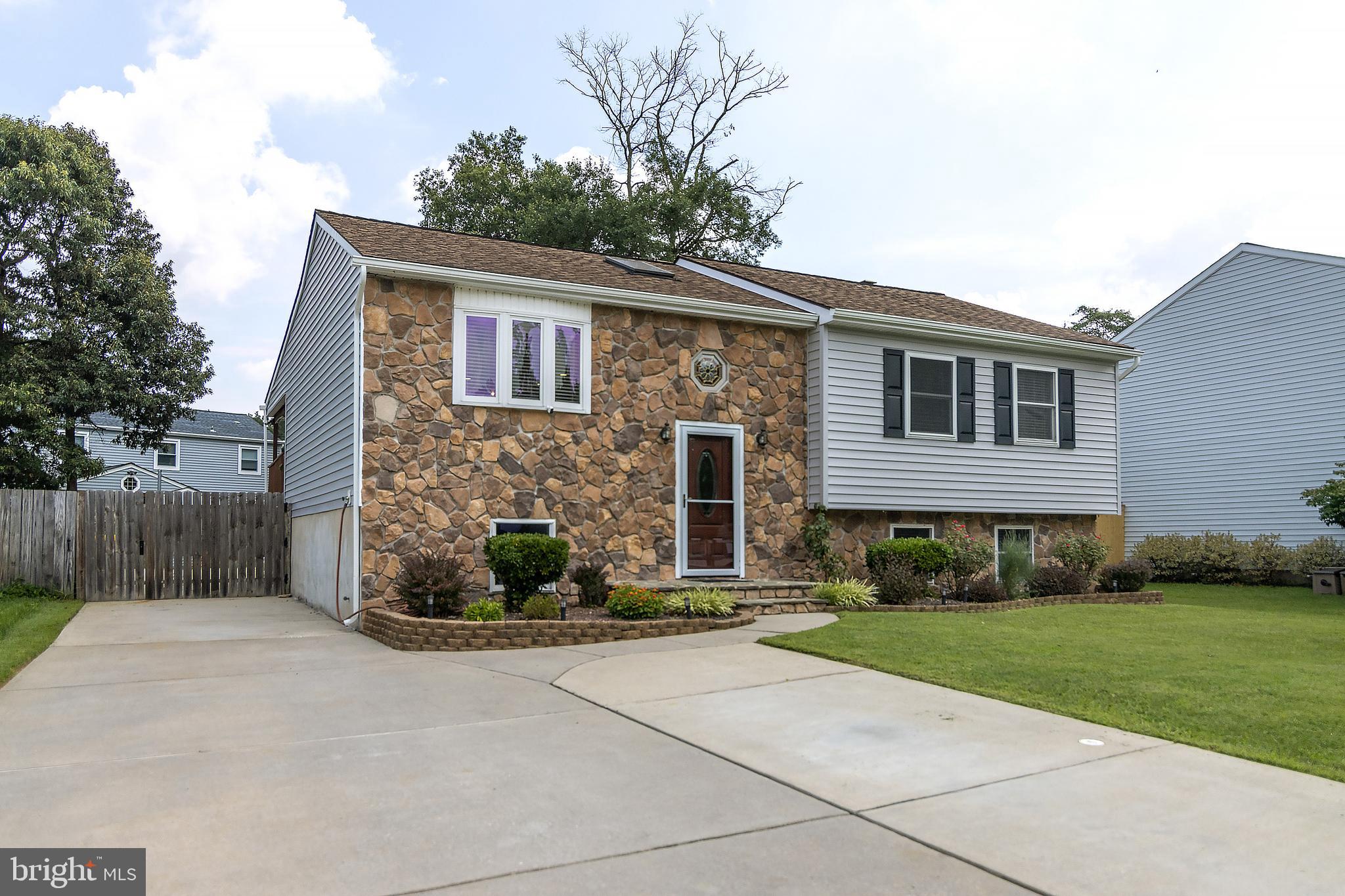 Beautiful newly renovated (2020) home. Enjoy your huge in-ground pool (18 1/2' X 36 1/2') and covered deck. Composite patio. This open concept kitchen living room features ample counter space w/ granite countertops, GE fingerprint resistant appliances, gas stove, and an abundance of soft-close cabinets. Newly remodeled from floor to ceiling, the full baths offer elegant tile, dual shower heads and wall heaters. Other updates include carpeting in bedrooms, ceiling fans in all rooms, laminate plank flooring and recessed lighting throughout the home. The finished basement boasts a large open living area with wood burning fireplace and a bonus room, could be an office, playroom or bedroom. Adjacent to the family room is a separate laundry space with a stand alone freezer and extra large capacity washer/dryer. HVAC system, siding, gutters and pool pump all replaced in 2022. Roof replaced within the last 10 years.