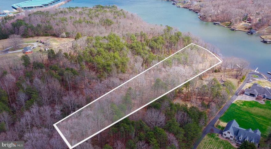 Tucked away on a private 1.5-acre waterfront homesite, this rare offering captures the very essence of lake life on the public side of Lake Anna. A gently sloping approach leads you through a beautifully wooded setting to an open level shoreline—an ideal canvas for creating your perfect waterfront retreat. Imagine designing your dream home to take full advantage of wide, open water views, where mornings begin with coffee on the deck as the sun rises over the lake, and evenings end with unforgettable sunsets reflecting across the water.

With shared waterfront access, you’ll enjoy the benefits of lake living without the restrictions of an HOA—giving you the freedom to build and live exactly how you envision. The property’s natural topography offers both privacy and usability, making it perfect for everything from quiet relaxation to hosting family and friends by the water’s edge.

Ideally located in the heart of Lake Anna’s public side, you’re just minutes from popular marinas, waterfront dining, and all the activities that make this lake such a sought-after destination. Whether it’s boating, fishing, or simply unwinding by the shore, this property offers a lifestyle that feels like a getaway—every single day.

Bring your vision, your builder, and your dreams—this is where your Lake Anna story begins.
Be sure to watch the video!