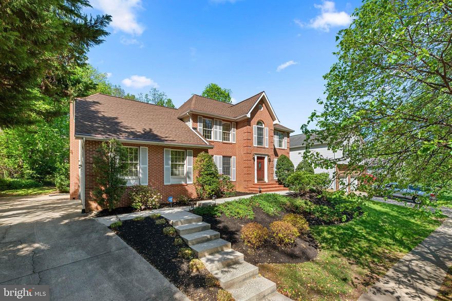 Welcome to this beautifully maintained brick front colonial, boasting over 4,000 sq ft of space, in sought-after Linthicum Heights—just minutes from parks, schools, commuter rails, and major highways. With no HOA fees and a long list of updates, this home is move-in ready and full of charm. Step into a grand two-story foyer and enjoy brand new carpeting (2025) and fresh designer paint (2025) throughout. The sunken family room features a cozy wood-burning fireplace, while the separate living and dining rooms offer great space for entertaining. Hardwood floors shine in the dining room, and the eat-in kitchen boasts granite counters and a newer stainless steel refrigerator. The main level includes a private office and powder room. Upstairs are four spacious bedrooms, two full baths, and a convenient laundry area. The primary suite features a walk-in closet w/custom closet organizers and private en suite bath. The lower level offers endless potential with a walk-up to the landscaped backyard, complete with screened-in porch, shed, and a 2-car side-load garage. Major updates include a new roof with architectural shingles (2018), high-efficiency Carrier HVAC (2014), and a Kohler natural gas generator. Don't miss this rare opportunity in a fantastic neighborhood with no HOA fees!