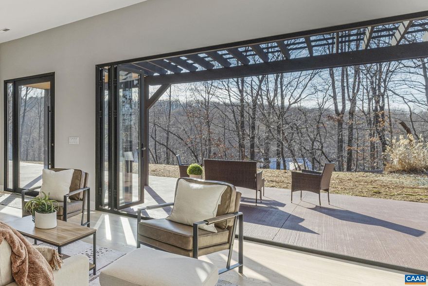 Stunning completely renovated 4-bedroom 4.5-bathroom home on 8.23 acres just minutes from Pantops! Zoned RA with possible development/division rights, this property is full of possibilities! 3 of the 4 bedrooms feature their own ensuite bathrooms. including a main floor primary with a Bluetooth-enabled shower with changing color lights. The main level has an open-concept layout with a gourmet kitchen and is perfect for entertaining. The kitchen features a Samsung Smart Family Hub refrigerator, a GE 5-burner gas stove, large pantry, and wall oven and microwave. The bi-folding glass doors that seamlessly connect the living space to an expansive patio are truly the highlight of the house. On the second level, the deck is accessible from two separate sets of French doors. Whether you are on the first or second floor, this house offers an effortless indoor-outdoor flow each with gorgeous mountain views. The property also boasts a 4-car metal garage, large enough to accommodate trucks, boats, and other large vehicles. Additionally, the enclosed, fenced area offers a secure space for livestock. Don't miss out on this rare opportunity!,Granite Counter