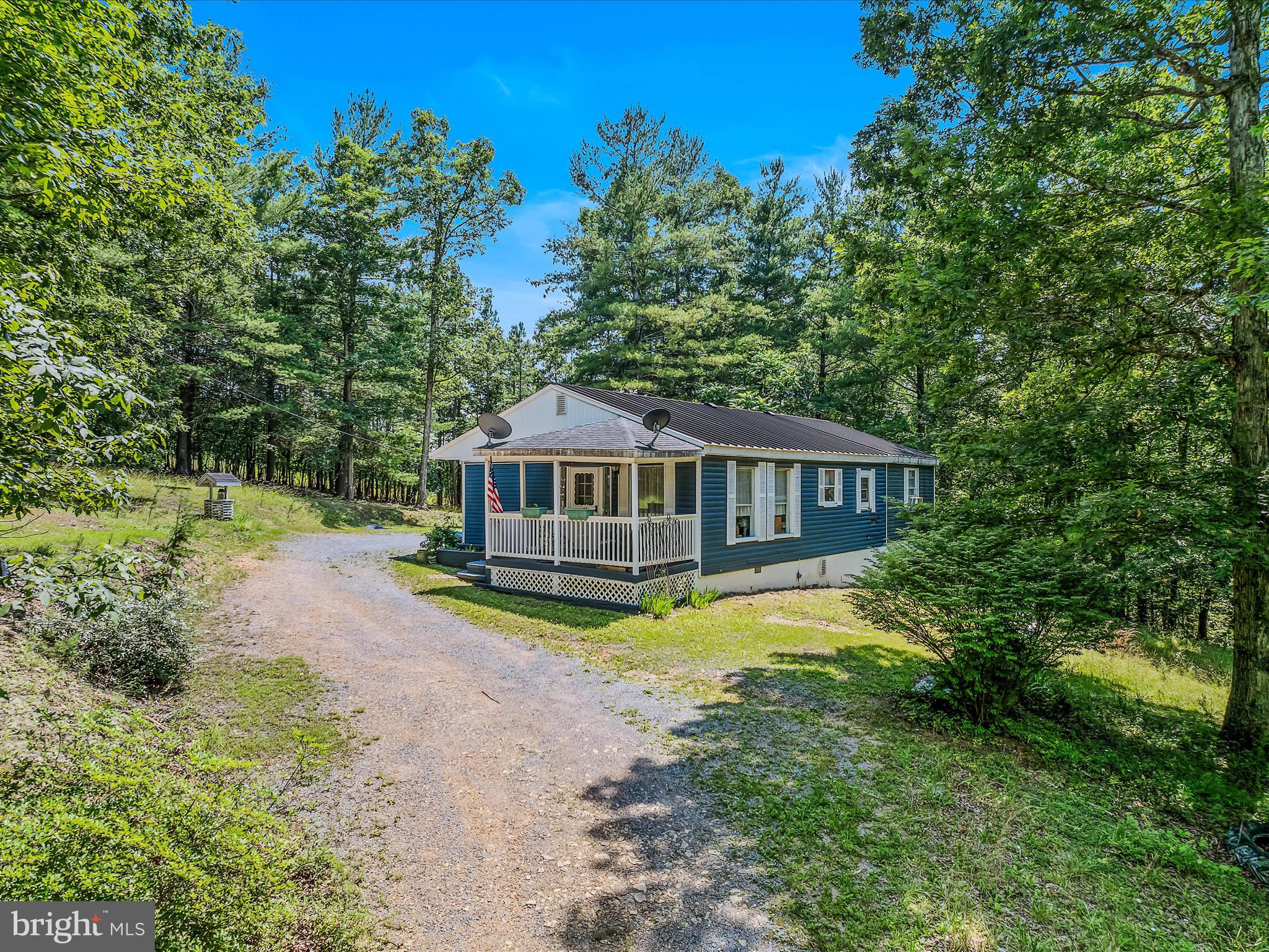 3 bedroom, 2 bath rancher located on a nice, wooded lot. Community features a pond. Mostly paved roads out to the property that are state maintained. Last 1/2 mile or so are gravel roads. Detached shed/garage for extra storage. A metal roof is also a nice features and a covered front porch. Large open kitchen and dining area. Living room features a gas log fireplace also. 2 parcels of land and the home sits off the roads nicely. Come take a look!