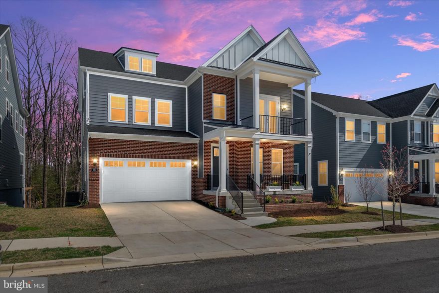 She’s one and a half years young. She’s flawless. She’s Annapolis.  Welcome to 141 Stilly Way — a barely lived-in, fully upgraded showpiece in the sought-after Parkside Preserve, offered in true mint condition. This is not a builder sale. This is the finished product — every bump-out, every upgrade, every design decision already made at the highest level. No waiting. No construction. No compromises. Just move in and enjoy.  The Lynnfield model was delivered at full scale, creating over 4,400 square feet of light-filled, beautifully finished living space across three levels. From the moment you enter, the home feels expansive, polished, and intentional. The open-concept main level flows effortlessly, anchored by a designer kitchen that delivers on every level — premium cabinetry with glass display accents, iced white quartz countertops, tiled backsplash, under-cabinet lighting, and a chef’s appliance package featuring double wall ovens (including air fryer), gas cooktop, stainless hood, and built-in microwave.  The adjoining family room is both inviting and impressive, centered around a gas fireplace and framed by serene wooded views. Expanded living and dining areas create the kind of space buyers are searching for — open, functional, and substantial. Step outside to the composite deck for seamless indoor-outdoor living, while the classic front porch adds timeless curb appeal.  Upstairs, the owner’s suite delivers a true retreat with tray ceiling, oversized spa shower, and a generous walk-in closet. Secondary bedrooms are beautifully appointed, and every bath throughout the home reflects elevated finishes — quartz countertops, maple cabinetry, and oversized tile.  The fully finished walk-out lower level sets this home apart. Complete with a fifth bedroom, full bath, and an expansive recreation space, this level is ideal for guests, multigenerational living, a home gym, or media space — all with direct access to the backyard.  Additional highlights include 9-foot ceilings on every level, a dramatic two-story great room, side-entry garage, and a striking brick and HardiPlank exterior.  Located just minutes from historic downtown Annapolis, Quiet Waters Park, shopping, dining, and major commuter routes, this home offers the lifestyle buyers want — without the timeline of new construction.  The seller’s relocation creates a rare opportunity to own a fully completed, meticulously upgraded home where nothing has been left undone.  This is the one.