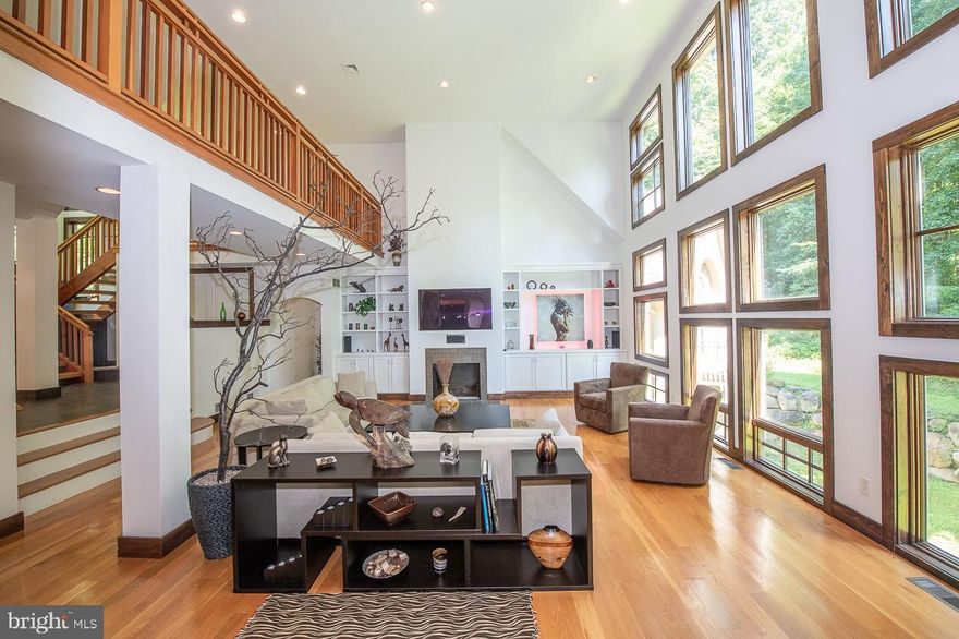 Perfect for Multi Generational living, First Floor Primary. Property offers  world class finishes, two main bedroom suites, also  an in-law quarts. The quality craftsmanship surpasses anything currently on the market located  in the heart of historic  Birchrunville is a 3 acre serenity inspired oasis set in the natural lands of French Creek.  Designed and crafted by Allen Entrekin, this one of a kind custom home is designed to integrate the owner w/nature while utilizing  the most advanced GREEN TECHNOLOGY and building systems. From the prefabricated walls offering staggering insulation values, to the state of the art Crestron automation and lighting system. As you walk through the entrance, the indoor water feature greets you with a tranquil sound. This remarkable home is graced by soaring ceilings, breathtaking architecture, and wall-to-wall windows  creating a soothing and intimate feeling throughout the home. The open floor plan offers a kitchen with granite countertops,  stainless steel appliances, cherry cabinets, deck and screened in dining area. The main floor master bedroom is connected to the main house by a raised bridge; the original landscape plan was to have a manmade stream running under the bridge.  For possibilities, future  owners can see the animated link, click on virtual tour icon. The master bedroom has an ensuite bathroom with open shower, spacious walk-in closet, and lower level gym. Upper level offers a office work area, 2 additional bedrooms and two full bathrooms. Daylight walkout lower level includes an in-law suite with full kitchen, art wall and a secret doorway that leads you to a mine shaft hallway with three theme rooms and  two full and one half bathrooms. An enchanted garden room, crystal Himalayan salt meditation room, and bunk bed room. The indoor water feature, crystal room, and well thought out design of this property truly provide a spa like feel for renewal of mind, body, and spirit. Property has a whole house commercial grade generator. Conveniently located close to the Birchrunville Post Office, Birchrunville Store restaurant, Butterscotch cafe, route 100 and the PA turnpike.