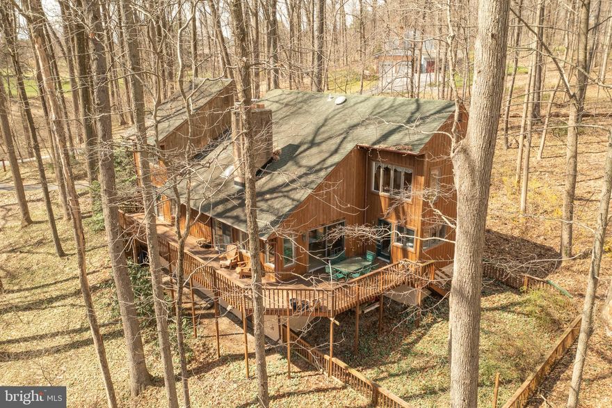 **OFFER DEADLINE HAS BEEN SET FOR 6:00PM ON SUNDAY, APRIL 3, 2022.**
WELCOME TO 2706 RAYNHAM CT -A NATURE LOVERS PARADISE!  Located in the highly desirable Baldwin neighborhood of Pleasant Prospect*This amazing custom contemporary home is nestled on a wooded 2 acre homesite at the end of a private cul-de-sac*Featuring 3 bedrooms, 3 1/2 bathrooms, fully finished lower level, 2 car garage & wrap around decking overlooking the woods & a stream*The main level boasts a large foyer, beautiful great room with wood burning fireplace & built in shelves, large country kitchen, formal dining room, spacious laundry/mud room & den or possible 4th bedroom with a walk in closet*The upper level includes the owners suite with updated full bathroom, 2 additional bedrooms, loft area & 2nd full bathroom*Downstairs you will find a large open recreation room, full bathroom, tons of storage & walkout to the side yard*The oversized 2 car garage is equipped with auto openers & built in car lift* UPDATES INCLUDE HVAC (2 yrs old), PRESSURE TANK & WELL PUMP (less than 1 yr) & ROOF, GUTTERS & GUTTER GUARDS (less than 10 yrs) OVER 2900 SQ FT OF LIVING SPACE AND AMAZING VIEWS FROM EVERY ROOM*THIS HOME IS TRULY A RARE FIND!