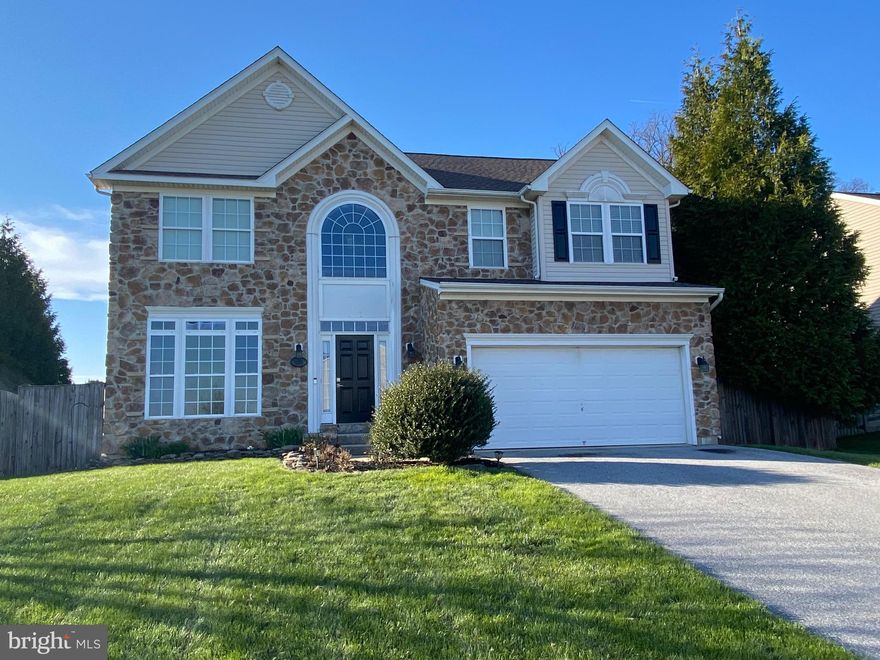 Welcome home to this exquisite four bedroom, two and a half bath residence in the highly sought-after Manchester Farms community! A light-filled two-story foyer creates a stunning first impression, leading into elegant formal living and dining rooms—perfect for entertaining.  The kitchen is a chef's delight, featuring stainless steel appliances, a spacious pantry, a charming corner sink, ample counter space, open shelving, and a breakfast area. The adjoining family room offers a warm, inviting space for everyday living, while the sun-filled morning room just off the kitchen is ideal for enjoying your coffee or relaxing with a good book.  Upstairs, you’ll find four generously sized bedrooms and two full baths, along with the convenience of an upper-level laundry closet. The primary suite is a private retreat, boasting cathedral ceilings, a large walk-in closet, and an en-suite bath complete with a soaking tub, double sinks, and a separate shower. The unfinished walk-out basement offers incredible potential, already equipped with a workbench and rough-in for a future bathroom—ready for your personal touch. Step outside to a private backyard oasis featuring a Trex deck with a built-in bench—perfect for grilling, entertaining, or simply unwinding.  Ideally located for commuters, this home is just minutes from major routes, shopping, dining, and parks.  This Hampton floor plan offers the perfect blend of luxury, comfort, and functionality. Don’t miss your opportunity to make this exceptional home yours!