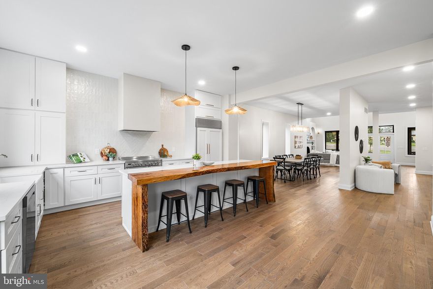 NEW BUILT  MOVE-IN READY | LUXURY FINISHES | GREAT LOCATION
Welcome to 105 W. 3rd Ave, a stunning move-in-ready new construction home that perfectly blends modern luxury, high-end craftsmanship, and small-town charm. Ideally located within ½ mile of shopping centers, parks, walking trails, and Main Street, and served by top-rated schools, this home offers both lifestyle and convenience. 
EXTERIOR FEATURES
Exceptional curb appeal welcomes you home with James Hardie Board-and-Batten siding, a real stone-accented front porch, and striking modern architectural details. The metal roof with pine tongue-and-groove ceiling adds warmth and timeless character, while grand double front doors invite abundant natural light into the home.
Energy-efficient Andersen black-trim casement windows enhance both style and performance throughout. Step outside to a maintenance-free composite rear deck overlooking an expansive 0.75-acre flat lot, surrounded by mature trees for privacy and peaceful outdoor living—ideal for entertaining, play, or future outdoor enhancements.
The oversized, fully finished two-car garage features recessed lighting, windows, insulation, custom 8-foot modern black garage doors, front driveway access, and a rear service door leading directly to the backyard—perfect for convenience and functionality.
INTERIOR FEATURES
This home is defined by luxury craftsmanship and thoughtful design. Solid hardwood floors run throughout, complemented by 10-foot ceilings and dramatic cathedral ceilings in the foyer and living room. Architectural arches, extra-large windows, and custom millwork elevate every space.
All 8-foot solid-core interior doors, paired with solid wood window and baseboard trim, create a cohesive, custom-built feel. Dual high-efficiency HVAC systems provide comfort and energy savings year-round. Each bathroom includes a Bluetooth speaker exhaust fan, blending modern convenience with everyday luxury.
FIRST FLOOR
The main level features a bright, open-concept layout ideal for entertaining and daily living. The living room is anchored by a designer gas fireplace with custom arched shelving, while a built-in arched coffee bar niche adds charm and functionality.
The chef’s kitchen is a true showstopper, offering premium cabinetry, custom-cut quartz countertops, a farmhouse sink, and Siteline sliding glass doors that seamlessly connect indoor and outdoor living. Oversized windows flood the space with natural light and showcase serene backyard views.
A stylish mudroom and laundry room feature custom shelving, designer wallpaper, and a large window overlooking the yard. The first-floor bedroom and full bathroom provide flexibility for guests, home office use, or multi-generational living, with floor-to-ceiling tilework and high-end fixtures.
SECOND FLOOR
The primary suite retreat impresses with a cathedral ceiling, custom walk-in closet, and spa-inspired ensuite bath featuring quartz vanities, luxury tile, and designer lighting. Secondary bedrooms are generously sized, each with ceiling fans, while bathrooms continue the home’s premium finishes and Bluetooth-integrated systems. Matching trim work, 8-foot doors, and refined details carry throughout the upper level.
LOCATION
Conveniently located minutes from Trappe and Collegeville, with easy access to shopping, dining, and major commuter routes, this one-of-a-kind luxury new construction home offers the rare opportunity to enjoy privacy, elegance, and everyday livability—all in a highly desirable setting.