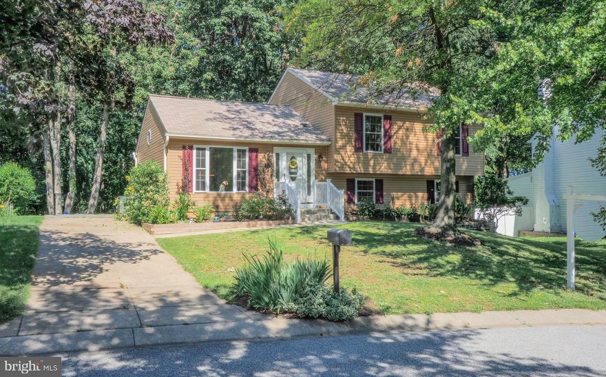 OFFER DEADLINE, 7pm tonight 6/28/2021!  Charming Split Level in a desirable community.  Turn key and worry free!  The kitchen has been tastefully updated with upgraded cabinetry featuring roll out storage shelves, Stainless steel appliances and granite countertops. The main and upper level have Hickory Hardwood Floors throughout with exception to the bathrooms, which are tile.  This home has 4 finished levels!!!  The primary bedroom has an en-suite bathroom and large closets with 4 bifold doors.  There are 2 bonus rooms in the lowest level that could be used as flex space, a home gym, guest room, or home office.  The large deck off the back is perfect for grilling out or entertaining friends and family.  The rear yard is private and backs to woods.  Troy Park, Rockburn Branch, and Harwood Park are nearby featuring basketball courts, playing fields, Bike skills course, tennis courts, playgrounds, etc.  New Windows 2018, New Siding 2019, HVAC 2016,  New Washer and Dryer 2019