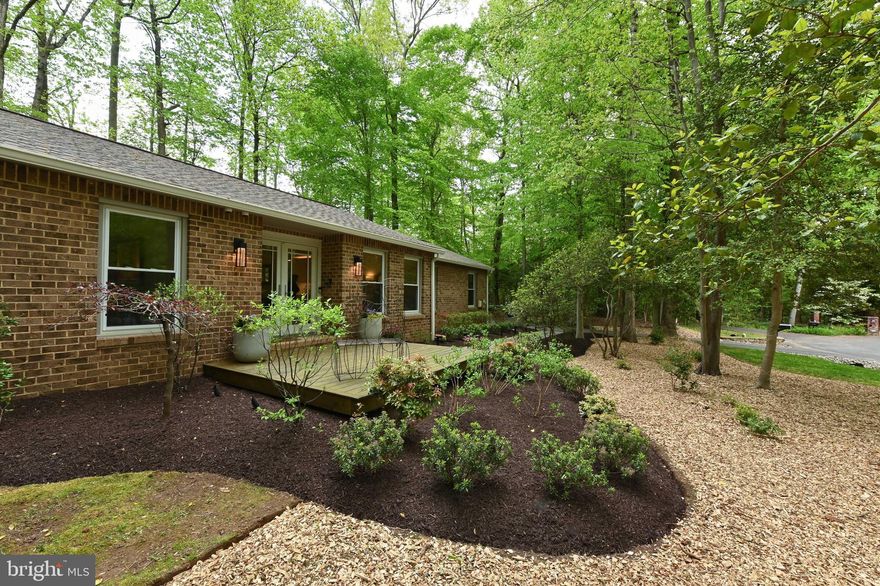 AMAZING NEW PRICE! Tucked away at the end of a quiet cul de sac on 1.03 acres, this 4 Bedroom, 2 bath Brick Rancher is an excellent value in today's market!  Private, peaceful and secluded LOCATION, yet close to  major commuting routes.  Enjoy easy one level living in the tastefully renovated kitchen with sparkling Quartz counters, over & under cabinet lighting, and backsplash. Cozy family room w/ a brick wood burning fireplace to keep you warm.  All seasons porch overlooks a private rear yard w/ a firepit for entertaining.  Oversized two car side load garage w/ extra storage.  Separate laundry room w/ utility sink. Four good size bedrooms, one of which has built ins for a future home office.
Well maintained:   Roof, water heater, HVAC & well pump replaced in the last 5-6 years.  
Davidsonville and South River schools.  ONE YEAR Cinch home warranty conveys!