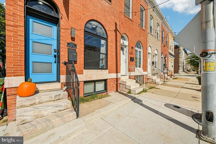 Welcome to this beautifully remodeled 3-bedroom, 3-bathroom classic end-of-row rowhome, perfectly situated in the heart of the vibrant Milton-Montford neighborhood. Just steps from a scenic green space ideal for walking your dog and a thriving community garden, this home offers the perfect blend of urban living and neighborhood charm.
Step inside to a sun-filled main level featuring luxury flooring, recessed lighting, a warm, modern color palette, and custom coffered ceilings. The open-concept layout boasts a spacious living room with a striking exposed brick wall, a generous dining area, and a stunning chef’s kitchen. The kitchen is equipped with ample cabinetry — including two pantry cabinets — granite countertops, a sleek tiled backsplash, and stainless steel appliances, including a slide-in gas range with a glass-and-stainless hood. A large center island offers deep sink access, pendant lighting, and breakfast seating for three or more.
Upstairs, you’ll find two large secondary bedrooms, a stylish full bath with a vessel sink, and a luxurious primary suite featuring another coffered ceiling, exposed brick wall, and a spa-like en suite bath with double vessel sinks and a beautifully tiled walk-in shower. The second-floor laundry area adds everyday convenience.
The fully finished lower level adds incredible versatility, offering a third bedroom, full bath, and a cozy sitting area — perfect for guests, a home office, or rental potential.
Out back, enjoy a private yard with a large patio, perfect for relaxing or entertaining family and friends.
Don’t miss this move-in-ready gem close to Johns Hopkins, downtown, and local parks — the perfect place to call home!