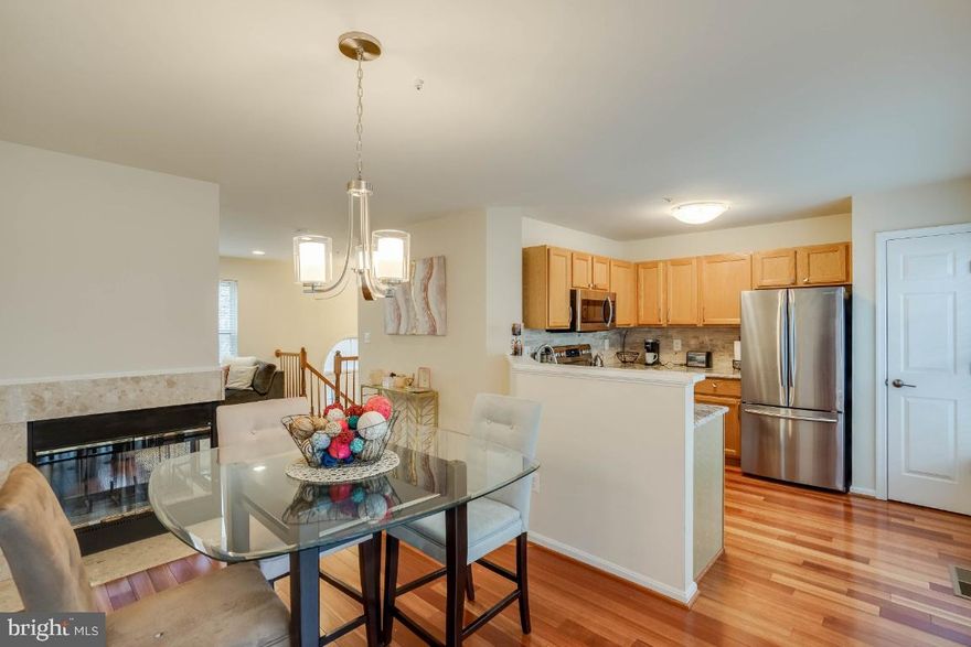 Beautiful end unit townhouse, in an awesome community. 3 bedrooms, 2.5 baths, 2 car garage, beautiful hardwood floors, granite counter tops, beautiful cabinets, fireplace, custom blinds and so much more.  This location is ideal for people who want access to DC at a great price.  Bright open and airy.   Open House; Saturday; March 7th  from 12-2:00 p.m.  Conveniently located near shopping and  restaurants.