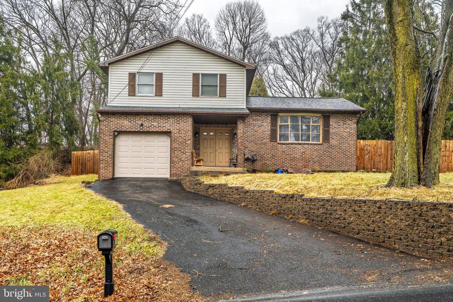 Come see this spacious and well-maintained split-level home that could be perfect for you. The property features 3 bedrooms, 1.5 bathrooms, and nearly 1,600 square feet of comfortable living space. The large, centrally located kitchen connects to both the spacious living room and the large family room, making it ideal for entertaining. The basement is currently used for storage but is already framed and professionally waterproofed with a sump pump, allowing for easy conversion into additional living space.  Recent improvements include a new roof, water heater, water softener and filtration system, UV light, well pump, refrigerator, dishwasher, fence, and more.  You'll also find a welcoming front porch, a convenient garage, and a fenced-in yard for privacy and outdoor enjoyment. The electric baseboard in each room is additional back-up heat. This home is move-in ready and waiting for you.  Schedule your tour today!