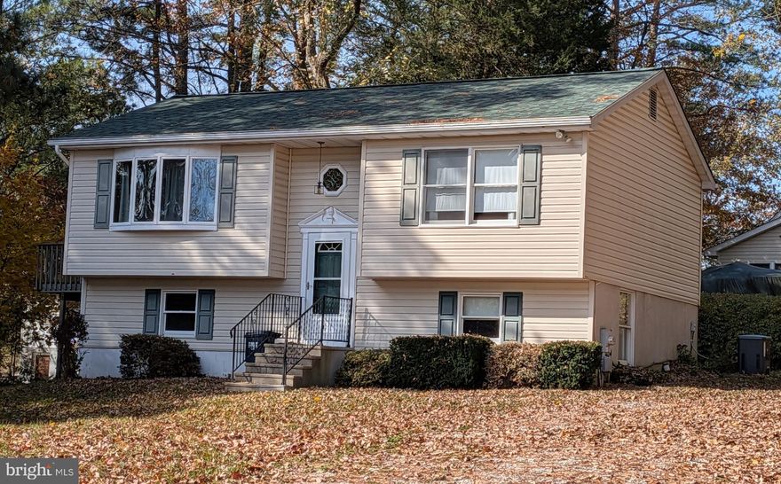 Discover the charm of this delightful split foyer home nestled in the serene Smiths Landing community, where comfort meets convenience. Built in 1996, this well-maintained residence boasts 1,075 square feet of thoughtfully designed living space, perfect for creating lasting memories. Step inside to find a warm and inviting interior featuring plush carpeting and vinyl flooring that seamlessly blend style and functionality. Enjoy the convenience of modern appliances, including a stove, washer, dryer, and House Generator ensuring that daily tasks are a breeze. This home offers three spacious bedrooms and two full bathrooms, providing ample space for relaxation and privacy. The lower level features a partially finished basement with a workshop and walkout access, perfect for hobbies or additional storage. Natural light pours in through double-hung and bay windows, creating a bright and airy atmosphere throughout. Outside, the property is equally impressive. The 0.26-acre lot features exterior lighting and a charming outbuilding, perfect for additional storage or a creative workspace. Enjoy evenings on the deck, where you can unwind and soak in the peaceful surroundings. The community is water-oriented, providing easy access to the North East River and Chesapeake Bay, where you can indulge in activities like fishing, boating, and swimming. Smiths Landing is not just a place to live; it's a vibrant community that offers a wealth of benefits. The neighborhood is known for its friendly atmosphere and strong sense of community, making it easy to connect with neighbors. Excellent public services and schools are just a stone's throw away, ensuring that everything you need is within reach. With public access to the water and a variety of recreational opportunities such as beaches, fishing pier, marinas, playground, athletic complex, this home is a haven for outdoor enthusiasts. Whether you're kayaking, sailing, or simply enjoying a day by the water, the lifestyle here is truly unparalleled. Don't miss your chance to own this charming home in a community that offers both tranquility and adventure. Experience the best of both worlds in Smiths Landing, where your dream lifestyle awaits!