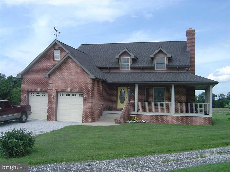 Beautiful custom built brick home set back on 11.8 acres. Vaulted ceilings, wrap-around porch & patio, 1st floor master suite, gorgeous red oak wood floors, 5 acres fenced for horses/livestock & 3 acres in hay, 32X32 barn, 6 car/equipment garage (32X50), full walk-out basement w/roughed in bath (see list for more improvements).