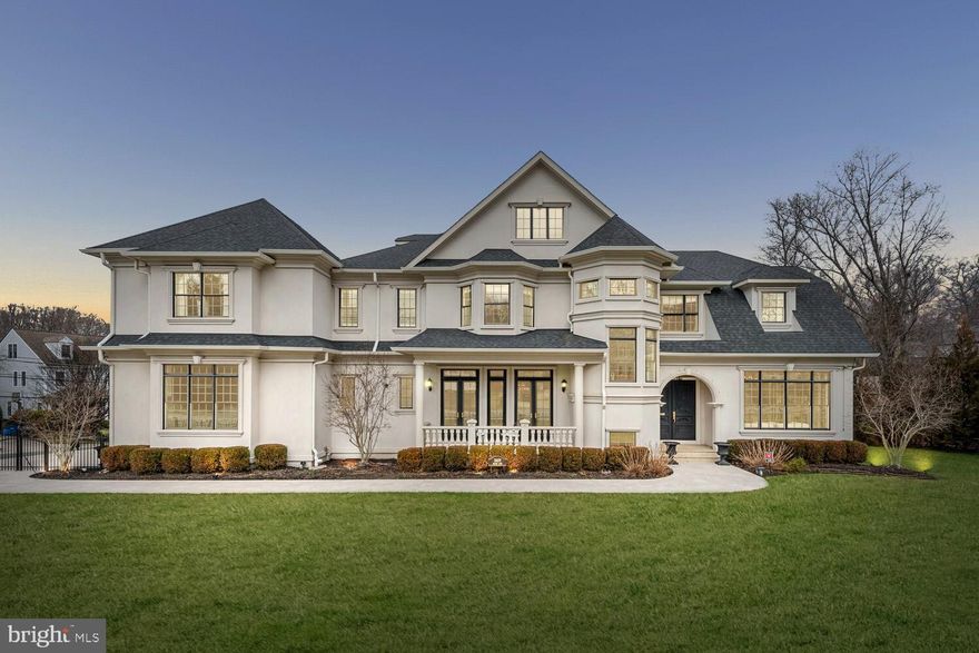 Exquisitely crafted with unparalleled taste and sophistication in one of Bethesda's most coveted neighborhoods, 5609 Wilson Lane presents an impeccable fusion of comfort, convenience, refinement, and timeless design. This distinguished custom home, recognized with prestigious awards, spans over 10,000 square feet of meticulously curated living spaces and private terraces.

The residence features 7 bedrooms and 8 bathrooms, each adorned with carefully chosen and expertly crafted fixtures and finishes. The expansive main level floorplan seamlessly blends spaciousness and tradition, showcasing a welcoming foyer, a luxuriously paneled study, formal living and dining rooms, and a gourmet chef's kitchen adorned with Carrera marble countertops. The adjoining plush family room boasts coffered ceilings and a gas fireplace, creating an inviting atmosphere.

Ascending to the second level, the master suite is a sanctuary of opulence, boasting his and hers boutique walk-in closets and a sumptuous en-suite bathroom. This spa-like haven encompasses every modern convenience, from an expansive dual sink Carrera marble vanity to an oversized walk-in steam shower room with a free-standing soaking tub. Three additional en-suite bedrooms on the second level, each with ample closet space, lead to a loft on the third level featuring four custom-built bunk beds.

The lower level of this extraordinary residence unfolds as an entertainer's paradise, with ample recreation space, a home theater, a fitness center, and a wine cellar with a tasting room. 5609 Wilson Lane is a dream home that transcends expectations, just moments away from all the lifestyle offerings of downtown Bethesda.