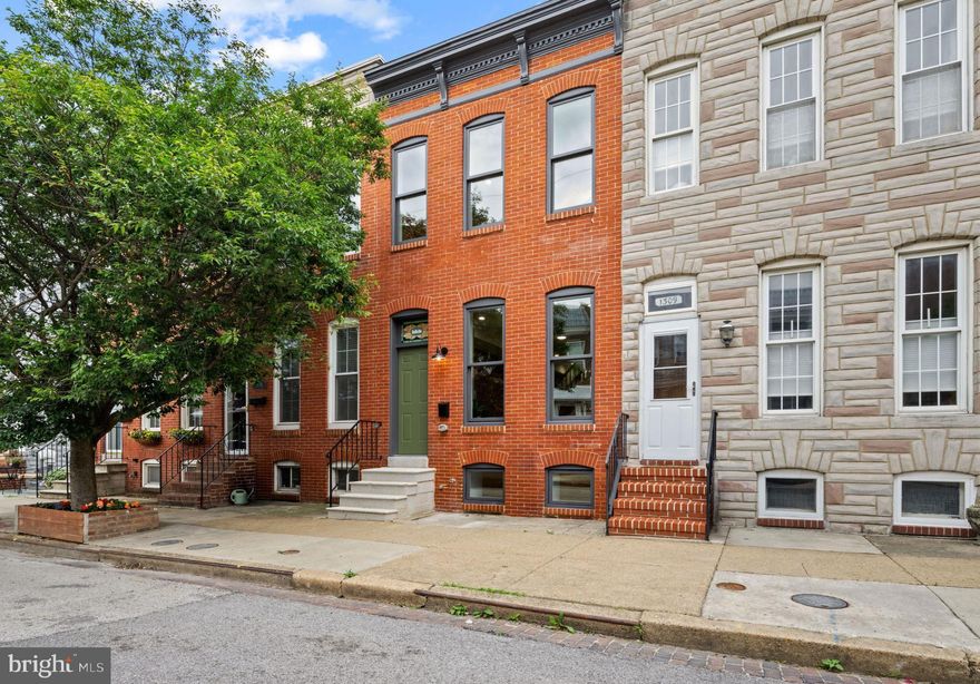Architectural Masterpiece in Locust Point! Renovated (CHAP) by John Bolster of New Renaissance Architect Builders! This 4BR/3.5BA townhouse perfectly blends Historic character with modern luxury. The main level impresses with exposed brick, wood floors, and a custom stained-glass transom. The gourmet kitchen, featuring high-end cabinetry and stainless steel appliances, opens to a private rear courtyard. The second level offers two spacious suites, including a primary bedroom with a walk-in closet, custom-built vanity & woodwork in the ensuite bath. The expansive rooftop deck provides breathtaking City and Surrounding Harbor views. The flexible lower level includes two private rooms and a full bath; perfect for a home office or guests. Experience one of Baltimore’s premier neighborhoods, home to the historic Fort McHenry, the lush greenery of Latrobe Park, and the convenient shops at McHenry Row. Enjoy local favorites like Limoncello and Barracudas, or take a scenic ride on the Water Taxi to explore Fells Point, Harbor East or Canton. With significant tax savings over 10 years via the CHAP credit and a top-tier location, this chic home is a rare find. Schedule your tour today!