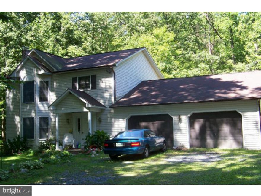 This is a Must See!  Ready for Immediate Possession!  Priced to Sell!  This home is in need of a TLC, but the potential is endless.  Located on 8.5 wooded acres in beautiful Berks County the property offers privacy while still being convenient to town. Entrance into the Foyer to the spacious Living Room with Bay window or down the hall to the large Kitchen with Center Island/bar.  Extended 2 car garage allows for extra storage or workbench.  Second floor has a full bath with two bedrooms and the Master Bedroom with another bay window and large closet.  The deck located at the back of the house provides quiet private area with creek view.  Located on the property are several outbuildings, some you may choose to keep others maybe not, but there is plenty of room for storage on the property.