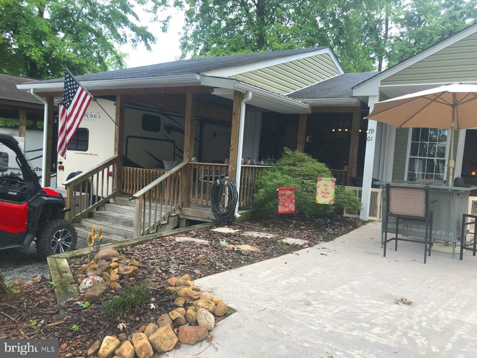 ***Property Details ***
Check out this rare opportunity! Large corner lot with two living quarters with only one set of dues. This lot comes with security doors that you can close up when you are gone. Comes with a 95 Club Car golf cart for you to get around the park. This lot has a large bar with a bar sink that has hot water, refrigerator, stove and plenty of seating area through out. Surround sound radio system throughout. Concrete driveway with a garage that is equipped with a garage door opener. The one living quarters is a beautiful 2014 Sunset Trailer 300 BH that can sleep 9 people. The extra living area has a large king size bed, sitting area and large bathroom. This room can sleep 3 more people for a total of 12 sleeping areas for all of your guests.
***BRING YOUR BEST OFFER*** YOU WON'T WANT TO MISS THIS ONE.***
This is a gated community so you need to enter at the guard shack. Entry is not permitted without ID per the office rules. Bring ID's to the office or guard shack for visitor pass. THIS IS A SEASONAL CAMPGROUND! OPEN FROM APRIL 1 TO NOVEMBER 1. ** WELCOME TO RIVER BEND/SEASONAL LOT AVAILABLE TURN KEY** River Bend is a privately owned 400 acre recreational- vehicle camp resort with seasonal activities for members, families and guests. This great RV park is tucked away on the Upper Potomac River of West Virginia, River Bend is one of West Virginia's most popular family seasonal destinations. . Just a short drive from the Washington and Baltimore metro area. Open with utilities from April 1 to November 1. Lot owners have access to their property the entire year. *** Members Enjoy *** * Amazing views and wildlife, Potomac River access, Trails, Swimming pools, Mini-Golf, Youth center, Tennis and basketball courts, laundry facilities, convenience store, deli and lounge. *Bath houses through out the park, boat ramp, bar and grill and even a church located on the grounds. River Bend also hosts numerous activities such as 4th of July fire works, small carnival, bonfires, poker runs, horse shoe tournaments, car show, Halloween Trick or Treat and so much more. Come and check out this amazing lot **** Lets bring an offer to to table!