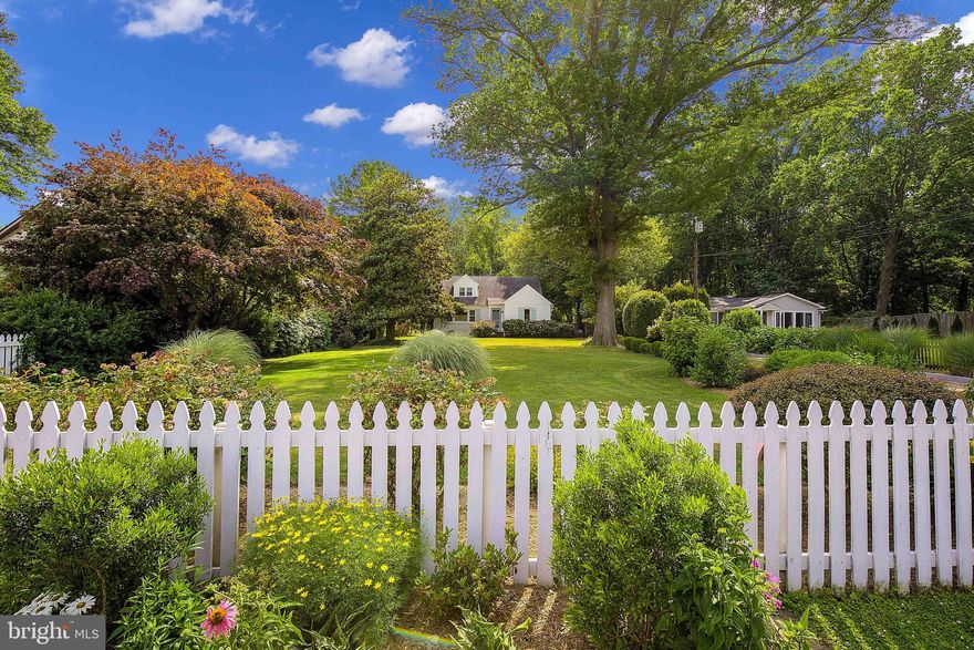 Welcome to 2106 Bay Drive, a storybook coastal cottage nestled in Annapolis with stunning views of the Chesapeake Bay. This picturesque property exudes charm and tranquility, surrounded by manicured landscaping and breathtaking water vistas. The colorful gardens and white picket fence set the stage for a truly enchanting setting, while the Magothy River and Bay provide a mesmerizing backdrop. Gaze at the water, the boats sailing by, and birds and wildlife from your living room picture window, while entertaining in your dining room, and as you wake up in the primary bedroom. 

Massive hydrangeas greet you as you approach the front door. Enter in through the arched doorway to the living room which features updated wallpaper and custom wood plantation shutters. A spacious dining room leads to the kitchen full of vintage charm. Mudroom to a side entrance leads to the driveway for easy parking and access. The main level features two generous bedrooms and a full bathroom. Head to the second level via the custom painted staircase which leads to an open loft area, use for desk space or sitting room! Two more bedrooms including the primary upstairs plus another full bathroom and lots of hidden storage.  The home has been tastefully updated while maintaining the charm and character of a coastal cottage: original maple floors, arched doorways, updated windows, updated appliances, a stainless steel lined chimney ready for a wood stove (as-is), custom woodwork, vaulted ceilings, dual zone heating/AC, updated washer/dryer, updated sump pump, updated attic fan, an unfinished basement ready for your touches, and more. 

Sitting on almost three quarters of an acre, this unique property also boasts an oversized two car Carriage House style detached garage with 9' wide doors, 10' interior height and over 400 sf of light filled bonus room/loft space above. Makes for fantastic storage or make it your own: studio, home gym, office, endless possibilities! An additional shed provides storage for yard equipment. Plenty of room to park a boat, RV or multiple cars on the gravel driveway around the garage. No HOA, short term rental potential!

Surrounded by Corcoran Woods nature preserve (215 acres featuring hiking and biking trails) and in close to Sandy Point State Park beaches and Podickory Point Yacht Club, 2106 Bay Drive provides an idyllic retreat for nature enthusiasts and outdoor adventurers. Enjoy the convenience of easy access to commuter routes (50 and 97), Downtown Annapolis, the Bay Bridge, and the Eastern Shore while relishing the peaceful serenity of your own private oasis.