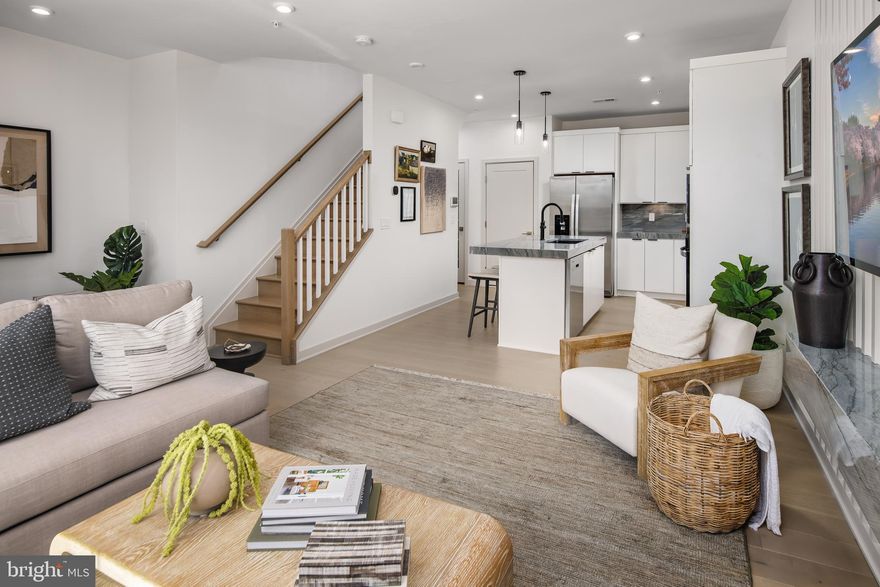 Steps from Ashburn Metro – Sully Classic | Estimated Move-in Early Summer 2026
Experience modern living at its finest in this beautifully crafted Sully Classic residence, perfectly positioned only moments from the Ashburn Metro. The community offers exceptional amenities, including a resort-inspired pool, clubhouse, fitness center, trails, and playground—everything you need for a vibrant, convenient lifestyle.

Inside, the home features a professionally curated kitchen complete with wood toned cabinets, brass fixtures, quartz countertops with continuous quartz backsplash, an island, and high-end KitchenAid stainless steel appliances—ideal for weeknight cooking or hosting guests.

The upper level boasts a generous primary suite enhanced by a tray ceiling, walk-in closet, spa-like bathroom with dual vanities, an expansive shower, and a private covered balcony. A dedicated laundry room on the bedroom level adds everyday ease, featuring Whirlpool front-load appliances, upper cabinetry, and a utility sink.

Additional standout features include additional side windows, oak staircase, wide-plank luxury vinyl flooring throughout the home.

Don’t miss this opportunity to secure a gorgeous home in one of Loudoun County’s premier metro-accessible neighborhoods!