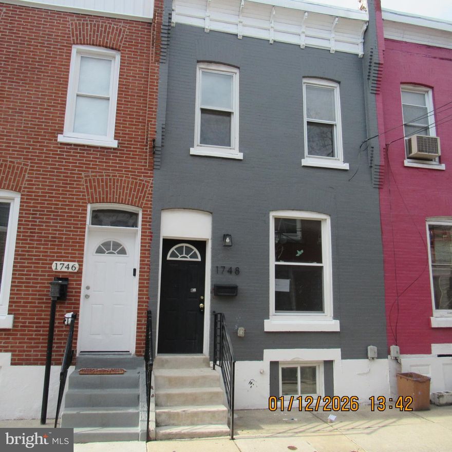 Two story row home featuring on the first floor living room, kitchen with rear entrance to deck, second floor features two bedrooms, hall bathroom, laundry area, finished basement with bathroom too!Features central air condition, on street parking. Home is being sold in as is condition,