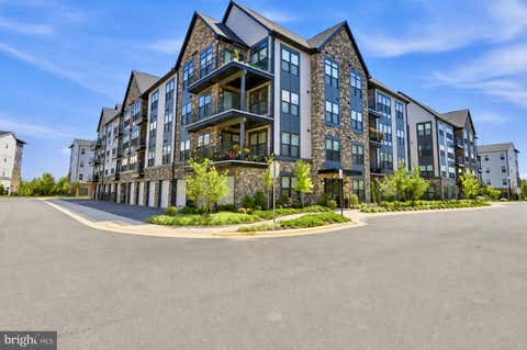 Photo of 23650 Havelock Walk Terrace #407, ASHBURN, VA 20148 (MLS # VALO2131476)