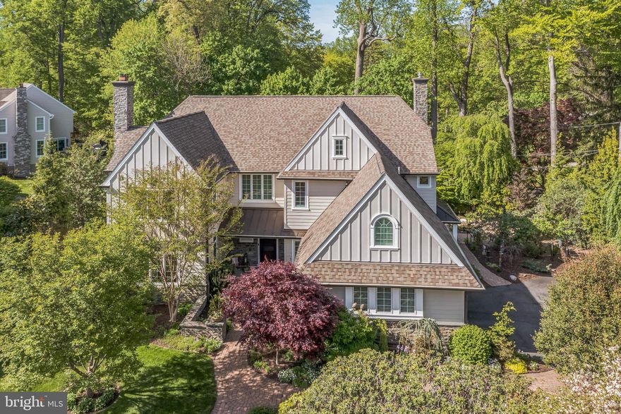 Welcome to a True Showstopper in Prestigious Jordan Estates!
Nestled just outside everyone’s favorite hometown of Media, this spectacular residence in the exclusive enclave of Jordan Estates is a rare gem. From the moment you arrive, the curb appeal is undeniable. The home’s full exterior renovation showcases a striking blend of Hardiplank siding, board and batten, and stone accents—beautifully complemented by standing seam metal roofing and architectural shingles that exude sophistication.
Step inside to a grand two-story foyer, flanked by a gracefully turned staircase and open sightlines to nearly every room on the main level. Exceptional craftsmanship is evident throughout—from site-finished hardwood floors and extensive custom millwork to Pella replacement windows that bathe the home in natural light.
The main level offers both beauty and functionality. A richly appointed office, elegant living room with a gas fireplace, and a formal dining room provide perfect spaces for work, relaxation, and entertaining. At the rear of the home lies the crown jewel: a chef’s dream kitchen. Outfitted with custom cabinetry, mosaic tile backsplash, top-tier Wolf appliances, a farmhouse sink, and a massive island, it’s designed for culinary inspiration and effortless hosting. Sliders from the breakfast area open to an oversized composite deck—ideal for outdoor entertaining—with a built-in gas line for grilling and steps leading to a serene patio with koi pond and waterfall.
The kitchen flows into a spacious family room featuring a stunning stone fireplace, custom carpeting, and oversized windows overlooking the landscaped backyard. Additional highlights on the main level include two stylish powder rooms, a generous mudroom, and a well-equipped laundry room.
Upstairs, retreat to the luxurious primary suite through double doors. Enjoy a tray ceiling, large sitting room (perfect as a second office), and a spa-inspired bath with heated floors, soaking tub, custom vanity with marble counters, and a walk-in closet. The upper level also includes a princess suite with its own bath and sitting area, plus two additional bedrooms with a shared hall bath. Don’t miss the abundance of linen closets and a charming laundry chute—a thoughtful touch of convenience!
The finished lower level offers even more space and flexibility, featuring a rec room with built-ins, gym area, full bath, art/craft/work room, and an expansive storage room.
Every inch of this home reflects quality and care. Lush landscaping with specimen plantings adds year-round color and interest. Mechanical upgrades include a whole-house generator, upgraded electrical service, newer zoned HVAC, on-demand hot water, and a water treatment system.
All this, just minutes from grocery stores, rail lines, downtown Media’s vibrant restaurant scene, and quick access to the Blue Route for an easy commute to the city or airport.
This home is a rare blend of comfort, quality, community, and convenience—wrapped in an absolutely stunning package.