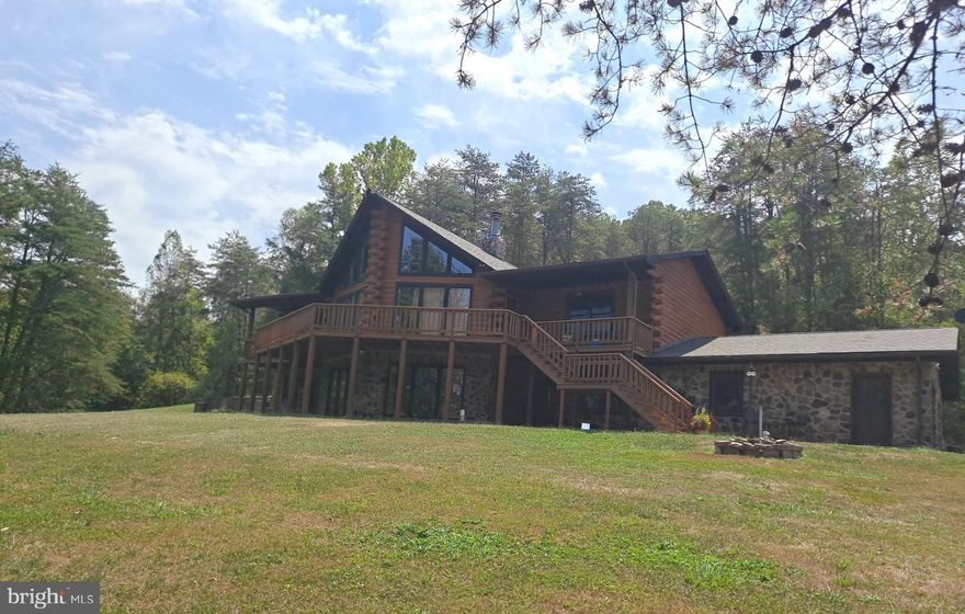 Welcome to this Gorgeous Secluded Log Home located in the foothills of Wild & Wonderful West Virginia. You will crest the driveway and view this custom log and stone-faced home on 84.76 private unrestricted acres full of deer, turkey, and other local wildlife. It has ATV trails throughout, two fishing ponds and wildlife ponds. There is a barn with tractor, brush hog and Plot master included. Century stone Fireplace, Furnace ties into Duct Work Plus Forced Air Gas Heat. Beautiful Hardwood Floors. Built-In Oak Bookshelves & Vacuum System. Two car garage.  New roof, new well pump, new septic clean-out installed,  trim and soffits painted, upstairs freshly painted, deck painted with Behr deck repair paint.  Only 34 miles from Charleston WV which is the capital for the State of West Virginia. Come and find your forever home in Almost Heaven West Virginia.