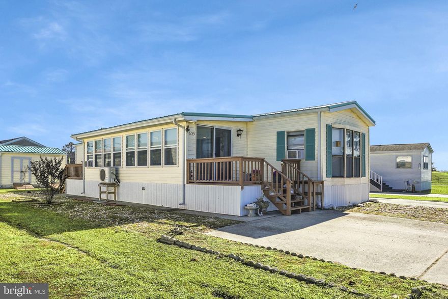 Cozy island mobile home! Presenting this charming 3-bedroom, 1.5-bath mobile home nestled at the tranquil south end of the island in the quaint Ocean Breeze community. This gem is hiding off the beaten path and features a generous living room, a sizable eat-in kitchen, breakfast bar, stainless appliances, jack & jill bathroom, and a full-size washer/dryer. Outside, a large shed provides additional storage space. The expansive enclosed sunroom, brimming with windows, serves as the perfect spot for entertaining visitors or hosting large gatherings. The property also offers a front and rear deck, perfect for appreciating the island's stunning sunrises and sunsets. To top it all off, an outdoor shower awaits you for a refreshing rinse after a beach day. The house's proximity to the town marina and bay is a bonus. With deeded land and zero HOA, this delightful property is not expected to linger on the market for long!
