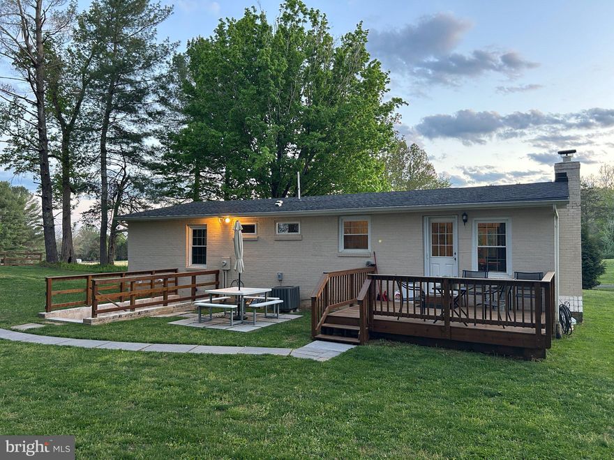 Tucked on a quiet 1.16-acre lot, this well-kept ranch offers the kind of space and setting that’s getting harder to find. The home sits comfortably, with mature trees, open lawn, and a fire pit area that feels made for evenings outside. There’s plenty of room to spread out, garden, or just enjoy a little breathing room.  Inside, the layout is simple and functional in the best way. The kitchen features granite counters, stainless appliances, and warm cabinetry, with enough workspace to actually cook and live in—not just look at. It opens easily into the main living areas, where hardwood floors and neutral finishes keep things clean and move-in ready.  All three bedrooms are on the main level, along with two full baths, making for easy one-level living. The lower level has drywall and is currently used as living space to add a lot of flexibility—whether you need a rec room, media space, hobby area, or just extra room to hang out, it’s already set up and ready for your flooring. Out back, the deck and patio give you options for entertaining or relaxing, overlooking the wide, open yard. The setting is private without feeling isolated, and there’s a nice balance of cleared space and natural surroundings. If you’ve been looking for a solid, comfortable home with land, usable indoor space, and a setting that feels a little more peaceful—this one is worth a look.