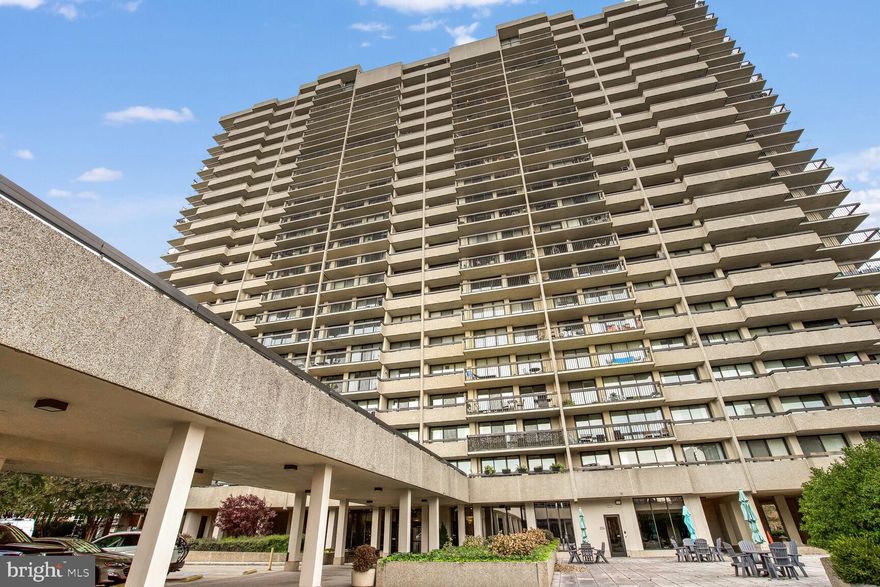 Impeccable re-imagined and renovated three-bedroom two and one half bath residence at Alexandria House. This seventh -floor condo with sweeping views of the Potomac and charming rooftops of Old Town Alexandria, afforded through a southwest facing wall of floor to ceiling glass that spans the entire length of the property. It is a complete renovation of the existing spaces.  New engineered flooring in all the living spaces. Carrera marble bathrooms with stainless fixtures, furniture grade vanities and heated front lit vanity mirrors accentuate a timeless and modern look. You are greeted with a custom bench and shoe space with sconce lights and fluted wall coverings. You enter the open concept main salon and living space with 9 ft ceilings and a fluted wood wall for accents, and sound dampening. To the left is the dining room with built in quartz stone hutch with storage and access to brand new kitchen. The kitchen features extended height cabinets in shaker white, quartz stone counters, Icelandic Carrera backsplash, custom undermount lighting and recessed lights and a custom cut alcove space which communicates nicely with the living room. The Kitchen has ample cabinet space, a counter depth fridge, separate wine fridge, massive pantry with butcher block shelves, and an induction stove. Bosch appliances and Grohe fixtures complete the space.  The primary bedroom has a walk-in closet with custom shelving, a linen closet and dual sink vanity, walk in shower with custom frameless glass shower door, and a one-piece toilet and massive lit heated fog free mirror. Sliding doors lead to the exterior 40 ft balcony. The middle bedroom and the second bedroom both feature ample closet spaces, access to the balcony, and large. The second bedroom also features a built-in library desk with storage, a place for a computer and book storage shelving built in, as well as a large walk-in closet. The second bathroom also features a 22 Inch soaking tub.  A separate laundry room with new stackable washer and dryer and extra storage finishes the spaces. A tucked in half bath for guests features a custom marble backsplash, tilt vanity mirror and mid-century cabinet vanity, and once piece modern commode.  The ceilings have been smoothed and popcorn removed with flush mounted modern LED lighting that accentuates the living spaces in the evening without interfering with the open spaces. Two parking spaces and a storage unit also convey with the sale. A delightful modern masterpiece, with charming features and high-end upgrades with enough space to spread your wings in the comfort of the best managed condominium in Old Town, steps to everything.
