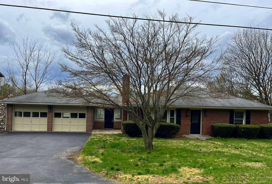 Welcome Home! Picture yourself in this beautiful, fully renovated brick rancher with loads of space! Conveniently located close  to Meritus Medical Center, HCC, access to Route 70, shopping and restaurants. This home boasts plenty of natural light throughout.  The living room has a brick fireplace for cozy nights at home.  The kitchen has brand-new stainless-steel appliances, quartz countertops and a timeless backsplash. Enjoy your morning coffee in the finished sunroom off the kitchen with decorative tile flooring and a view of the backyard.  Refinished hardwood floors throughout the main level and new fixtures throughout the home!  Head downstairs to a very spacious finished lower level, complete with a sizeable laundry room, another full bath, and a bonus room that can be a 4th bedroom or an office!  You will be welcomed by a very large family/rec room with recessed lighting for entertaining!  Another special aspect is the massive workshop area, which may also be used for extra storage as well.   Additionally, there is a very large 2 car garage and large back yard!  Come see for yourself!  Note: (2 entry doors Main level and 2 doors on lower level - stairs from front yard to back yard on side of house).