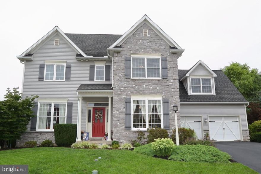 Move in and prop your feet up. This immaculate home offers a great livable floor plan with custom trim work, hardwood floors and lots of space for entertaining inside and out. The lower level is mostly finished and features a wet bar, full bath, gas fireplace and doors that open to a patio and private, well landscaped back yard. Over 4000 square feet of wonderful living area.