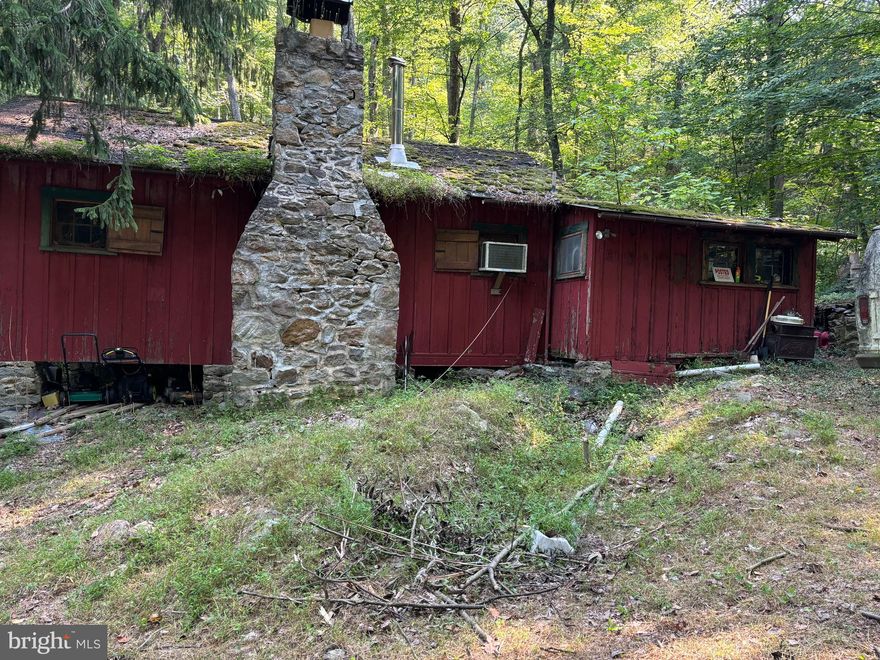 ***Multiple Offer Received. Best and Final due 2pm today. Thanks!*

Awesome find - remote cabin that used to be a boy scout retreat. Secluded. Peaceful, beautiful lot. Active Spring and creek on property. Cabin needs a lot of work, being sold as is! Had an off market cash offer that wanted electric run to the home prior to settlement. Started the process with Potomac Edison, new owner can pick up where we left off to install new meter, private bridge access needs some type of repair for work truck to get get across. Seller is in hospice and can't do any repairs outside of standard sale.