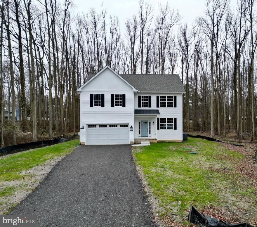 Completed home located on great corner lot located at the end of New Jersey Rd. Vertical siding,  upgraded garage door and metal roof over front porch. 9 foot ceilings on the first level.  9 x 16 foot composite deck, vinyl rails with steps to grade.  This home has modern feel to it with a classic layout.  Upgraded kitchen cabinets with soft close, granite and large kitchen pantry. Stainless steel appliances. Master bedroom  is more than accommodating with 3 closets and private bathroom with custom glass shower door. Granite vanity tops in bathrooms. Upgraded interior rails with metal pickets, square trim and black hardware lever hardware. All bedrooms are pleasingly spacious. Crawl space is insulated with spray foam and includes drain tile, sump pump and vapor barrier to seal off crawl space. House is move in ready all finial inspections compete!!