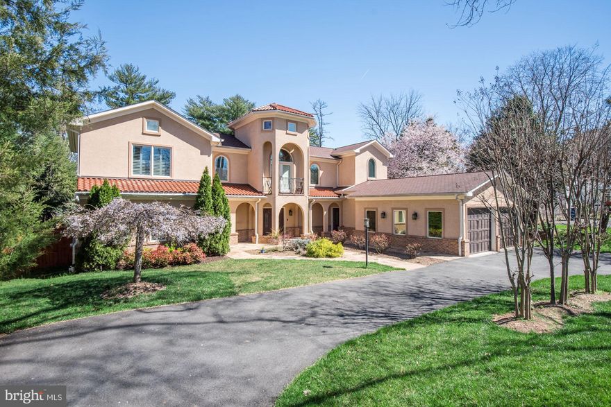 PRICE CORRECTION! Don’t miss this amazing chance! Welcome to this stunning Mediterranean villa, a masterpiece of architectural design nestled on a generous half-acre lot within the highly desirable and sought-after neighborhood of Luxmanor. Built in 2009, this custom-built (by Kader Construction) and detached residence showcases a harmonious blend of elegance and functionality, featuring exquisite stucco construction that exudes timeless charm. As you approach the property, the inviting façade and oversized front-entry garage set the tone for what lies within. Step inside to discover an expansive 10,457 square feet (estimated) of thoughtfully designed living space, where hardwood and tile flooring create a seamless flow. Be greeted by a two-story foyer and incredibly high ceilings in each part of the property. The open layout is perfect for entertaining, while the two cozy fireplaces add warmth and ambiance to the living areas. This home is quite possibly the most unique offering in the area, boasting two separate living quarters conjoined by a shared great room - designed for a multi-generational living approach. In addition to being ideal as a multi-generational home, either side of the house can be designated as a legal Accessory Dwelling Unit (ADU), providing a unique opportunity to offset the cost of living or generate extra cash flow. Another idea? Just have your friends and extended family move in! Enjoy two massive kitchens within the home, flanked by family rooms and connected by the generous great room. On the main level, find three bedrooms and 3.5 bathrooms; on the upper level, find four bedrooms and two bathrooms; on the lower level, find an additional bedroom and two bathrooms. This brings the total to 8 bedrooms and 7.5 bathrooms. Each side of the residence can be closed off from the other, offering a private living space with both corridors functioning as standalone homes, complete with bathrooms, bedrooms, laundry facilities, exterior entries (front and back), and more. Also, a notable feature is the main-level primary suite located on one side of the home (with laundry facilities) and an upper-level primary suite on the other (also with laundry facilities), allowing for flexibility and choice when it comes to sleeping preferences. The villa's architectural style, characterized by its graceful arches and intricate detailing, reminiscent of classic Mediterranean aesthetics, adds charm and appeal. Natural light floods the interiors, enhancing the spaciousness and highlighting the exquisite craftsmanship. The design emphasizes comfort and sophistication, making it an ideal canvas for your personal touch. The outdoor rear space features an expansive rear patio, partially covered and partially open, creating a serene retreat that allows you to appreciate the beauty of the surrounding environment fully. With ample parking options, including an attached garage and driveway space for up to eight vehicles, convenience is a top priority. This property is not just a home; it is a statement of luxury living, where every detail has been meticulously crafted to provide an unparalleled lifestyle experience. Location, location, location - just minutes away from all of the action at North Bethesda/Pike & Rose, Downtown Bethesda, Rockville, featuring Metro Stations, Restaurants, Shopping, Groceries, Trader Joe's, Parks, Trails, and more - while being near both I-495 and I-270. Don’t miss the opportunity to make this architectural gem your own.