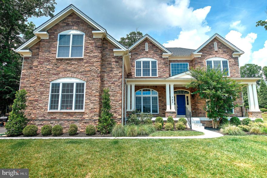 Beautiful, like new (2017) stone front Toll Brother Colonial with expansive front porch on a .63 acre cul de sac lot! Over 6600 finished sq ft and over $150K in options and upgrades including a 3-car side load garage, wide plank hardwood on main level,  Upgraded Mold “Heritage Trim Package”, Solarium off of Gourmet Kitchen (with Butler’s Pantry, Wine Fridge, Drop Zone, Granite & Stainless appliances), Expanded Family Room with “Box Beam” ceiling and gas FP, elegant Library with custom full wall bookcase cabinetry, fully finished lower level with a fabulous 2 BR, 1 Bath IN-LAW SUITE with 2nd gourmet kitchen! Upper level features Huge Primary Suite complete with spacious Bedroom with tray ceiling, Sitting Room, THREE Walk-In Closets, Dressing Area and SPA BATH with separate vanities!  Truly a MUST SEE!