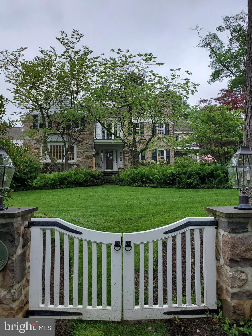 Move right into this sophisticated fieldstone colonial on one the most highly coveted streets on the Main Line!   Situated on a lush beautifully landscaped property this home was meticulously re-designed to enjoy open and flexible space without giving up any of the classic elegance and charm that the Main Line is so well known for.  The gracious front to back foyer is flooded with light.  The expansive living room with fireplace has access to a charming covered flagstone patio and just down the hall you come to the library which also enjoys access to this charming patio and features extensive built-ins and a fireplace.  The very large custom gourmet kitchen (new in 2019) opens to a stone and glass breakfast room, there is a large family room and den at either of the kitchen - extraordinary and flexible space.  All these rooms open to the pool, patio and lanai area. A wonderful space for entertaining alfresco and lazing around with your family.  Stone stairs lead you from the pool area to the expansive rear grounds. The second floor has an elegant Master Bedroom, A bedroom with an en-suite bath, two bedrooms sharing a jack and jill bath and a  bedroom suite with sitting room.  The laundry is also conveniently located on the second floor. The attached three car garage is accessible through a custom mudroom and  features a fantastic 1000 square foot space above that walks out to a 400 square foot balcony overolooking the pool and grounds.  This light filled space features extensive built-ins, full bath and kitchette.  This large and flexiable space is accessed by a private staircase off of the mudroom.  The lower level of this home is beautifully finished with a stone fireplace, full bath and a plethora of space for many activities.  This picturesque property is just a short stroll to the center of Gladwyne Village and Gladwyne Park.  This home enjoys the classic elegance of a Main Line Colonial with the modern amenities of an impeccably renovated home with family and openness in mind. All of this and, amazingly, you close to enjoy award winning schools, parks, shopping and dining in King of Prussia, Suburban Square, and just 12 miles to Center City Philadelphia!    This is a very special home,