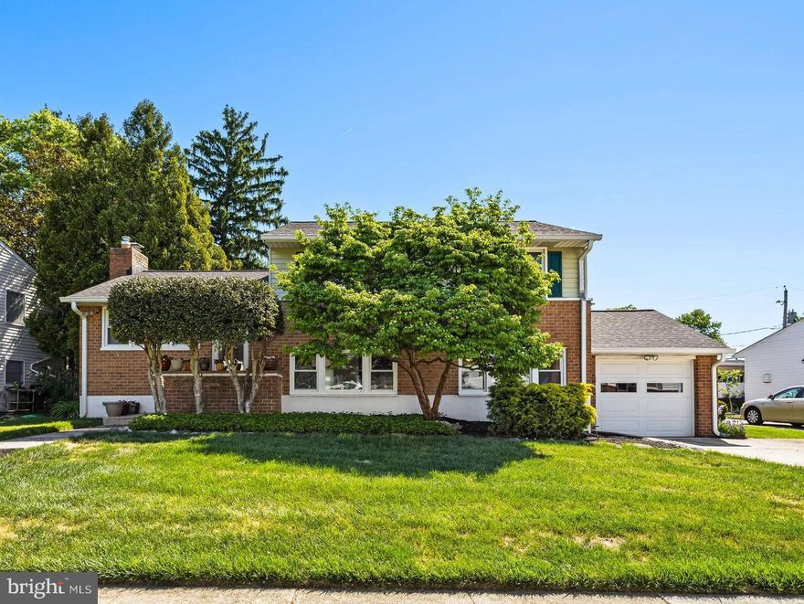 Beautifully updated 3-bedroom, 2.5-bath split-level home featuring a spacious eat-in kitchen and family room, gleaming hardwood floors, and a screened porch overlooking a flat, fully fenced backyard. Professionally landscaped with a one-car garage and oversized double driveway offering ample parking. Cozy fireplace included.

The finished sub-basement offers flexible space that can serve as a 4th bedroom, home office, or recreation area. Additional updates include architectural shingle roofing, replacement windows, and upgraded gutters and downspouts for low-maintenance living.  Photos to be uploaded soon.