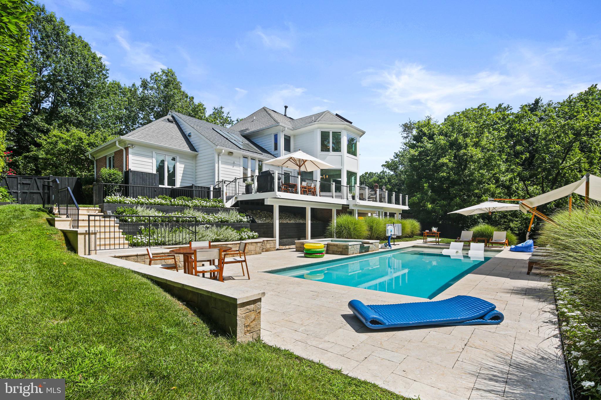 Be sure to see VIRTUAL TOUR for a 3D tour of the home!
Discover resort-style living in this exceptional five-bedroom, four-and-a-half-bathroom home nestled in the prestigious Kentsdale Estate section of Potomac. This newly listed property offers an ideal blend of comfort and sophistication, perfect for families seeking both luxury and functionality in one of Maryland's most desirable neighborhoods.
Completely re-designed and renovated in 2015, this is a custom home with high end finishes similar to a resort. The thoughtfully designed layout features five spacious bedrooms, including a stunning primary bedroom that serves as a private retreat. Each of the four full bathrooms, as well as the half-bath, showcases quality finishes. The home's redesigned configuration creates an open floor plan from the kitchen, with 2 white Carrera marble islands, to the dining area and beyond to the family room.
Step inside to experience the resort-style atmosphere that defines this remarkable property. The interior spaces are crafted with attention to detail, offering comfortable living areas that seamlessly blend relaxation with elegance. Large windows throughout the home invite natural light, creating bright and welcoming environments in every room. The step out to an expansive deck, with enough room for a 10-seat dining table. The expansive deck overlooks the pool, spa and gardens.
The location provides exceptional access to some of the area's finest recreational opportunities. Nature enthusiasts will appreciate the proximity to Locust Grove Nature Center, offering peaceful trails and educational programs just minutes away. Families can enjoy outdoor adventures at nearby Cabin John Regional Park, featuring playgrounds, sports facilities, and scenic walking paths. For those seeking more extensive outdoor experiences, the renowned Great Falls Park provides breathtaking waterfall views and challenging hiking trails.
The Potomac location offers the perfect balance of suburban tranquility and metropolitan convenience. Residents enjoy access to highly-rated schools, upscale shopping destinations, and diverse dining options. The community's tree-lined streets and well-maintained neighborhoods create an atmosphere of refined living while maintaining easy access to major commuting routes.
This property represents an outstanding opportunity to join one of the region's most sought-after communities. The combination of resort-style amenities, thoughtful design, and prime location creates an exceptional living experience. Whether you're looking for a peaceful retreat or an active lifestyle surrounded by natural beauty and cultural attractions, this custom re-designed home delivers on every level. The five-bedroom layout provides flexibility for growing families, home offices, or guest accommodations, ensuring the space adapts to your changing needs over time.